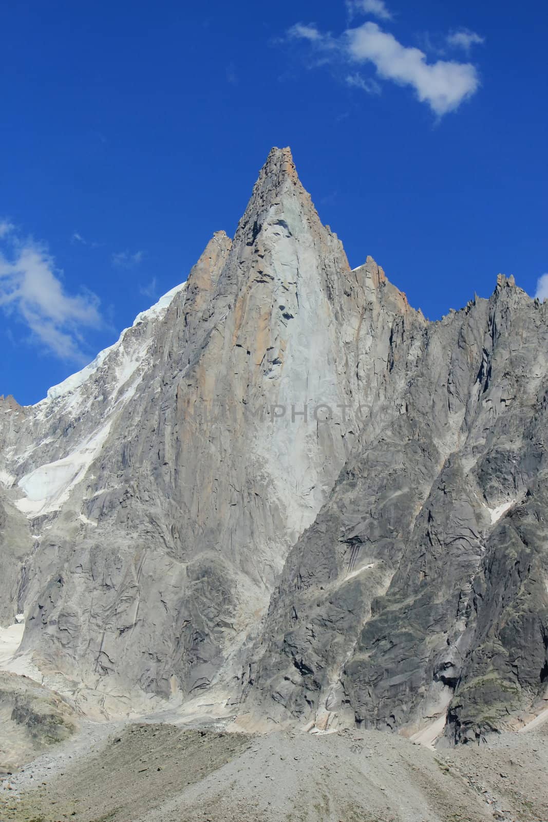 Aiguille des Drus and little clouds by beautiful summer day, Chamonix, France