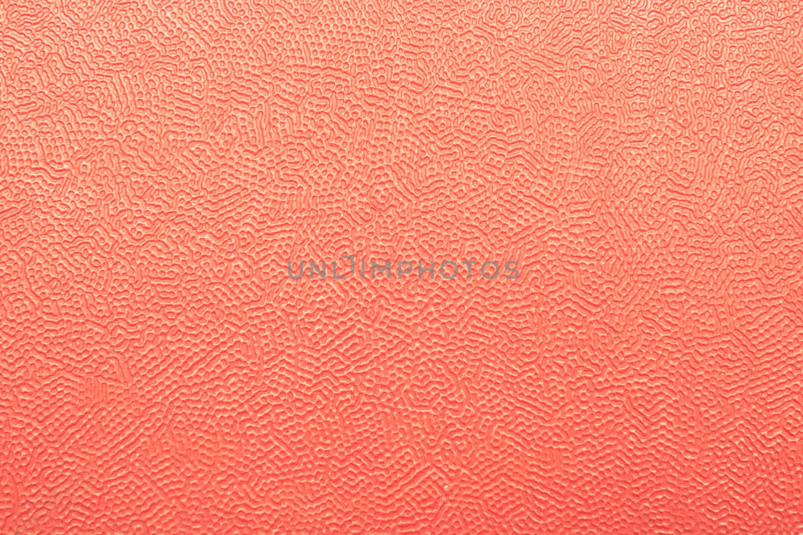Grainy red plastic sheet as a detailed background image