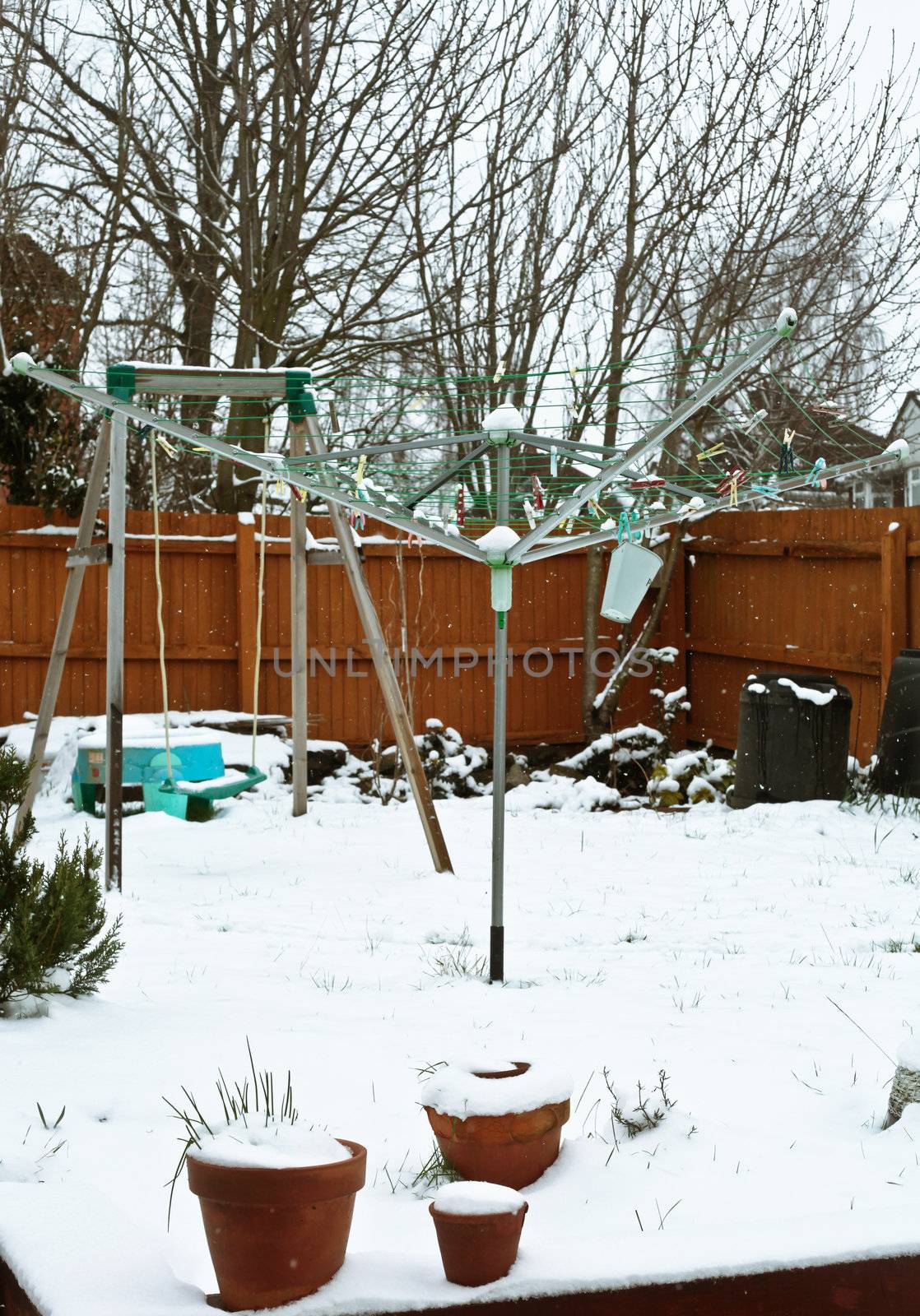 Snow falling in a home garden in the UK