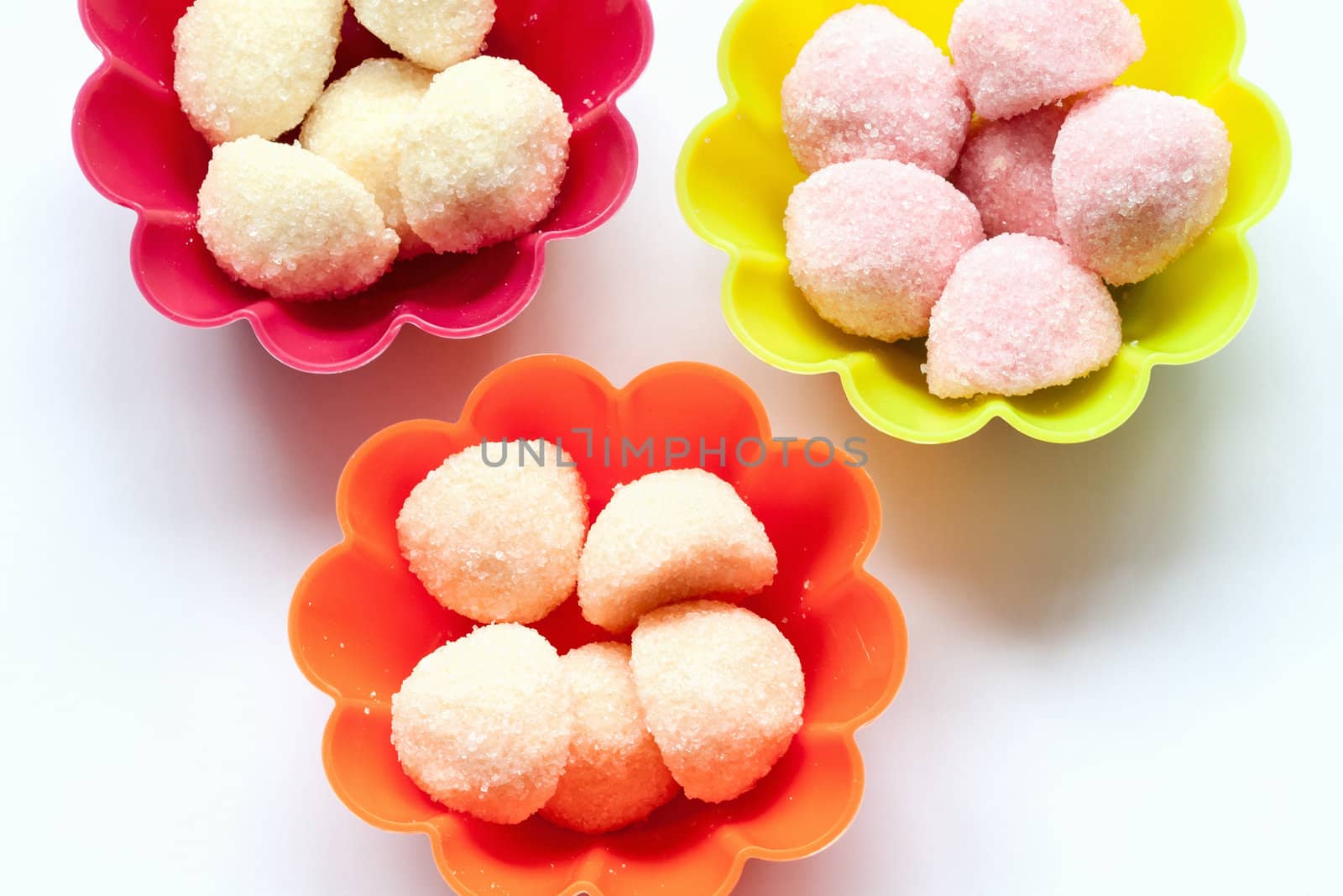 sweet jelly candies in cup cake cases on white