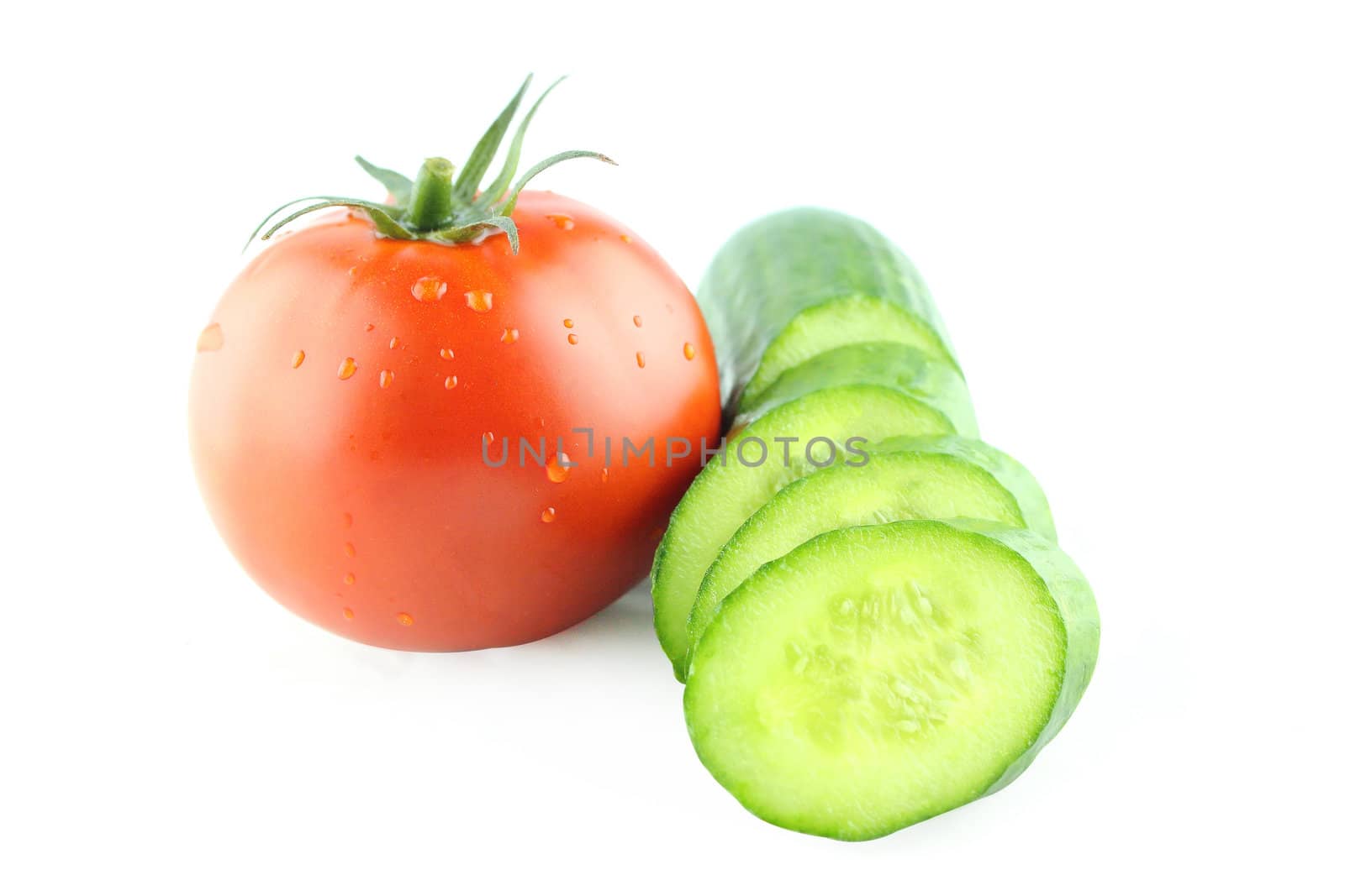 fresh tomatoes with Slices of cucumber on white background. with a clipping path