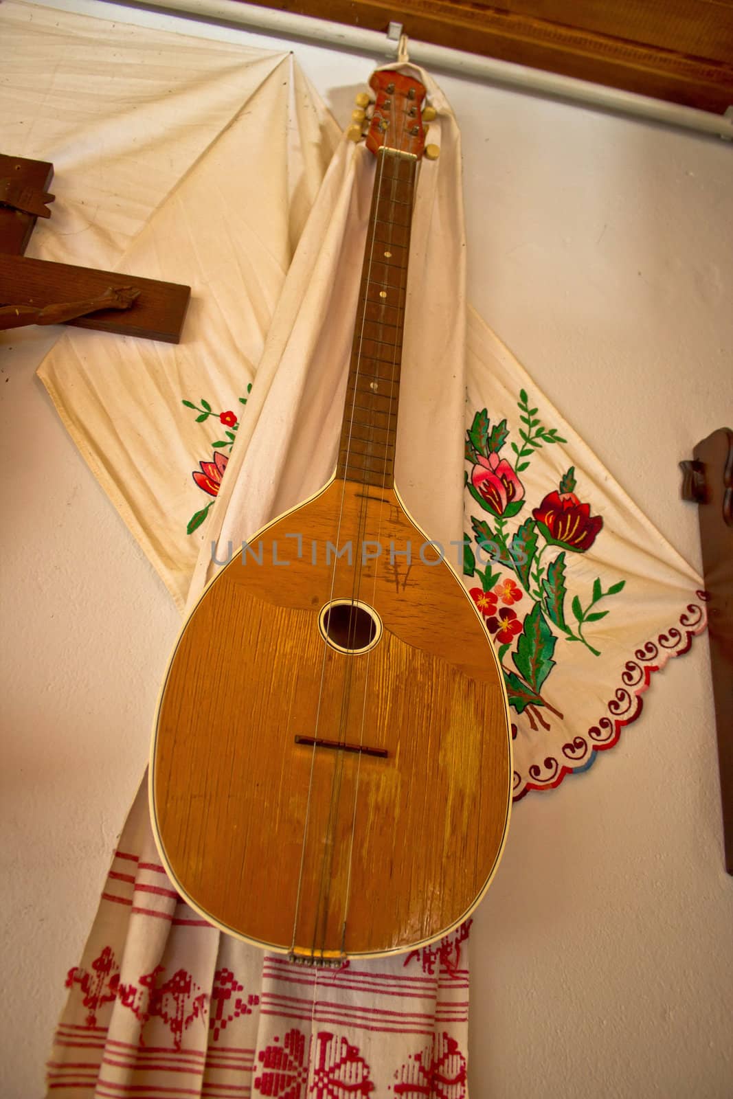 Tamburica (tambourica)- Croatian traditional music instrument on the wall