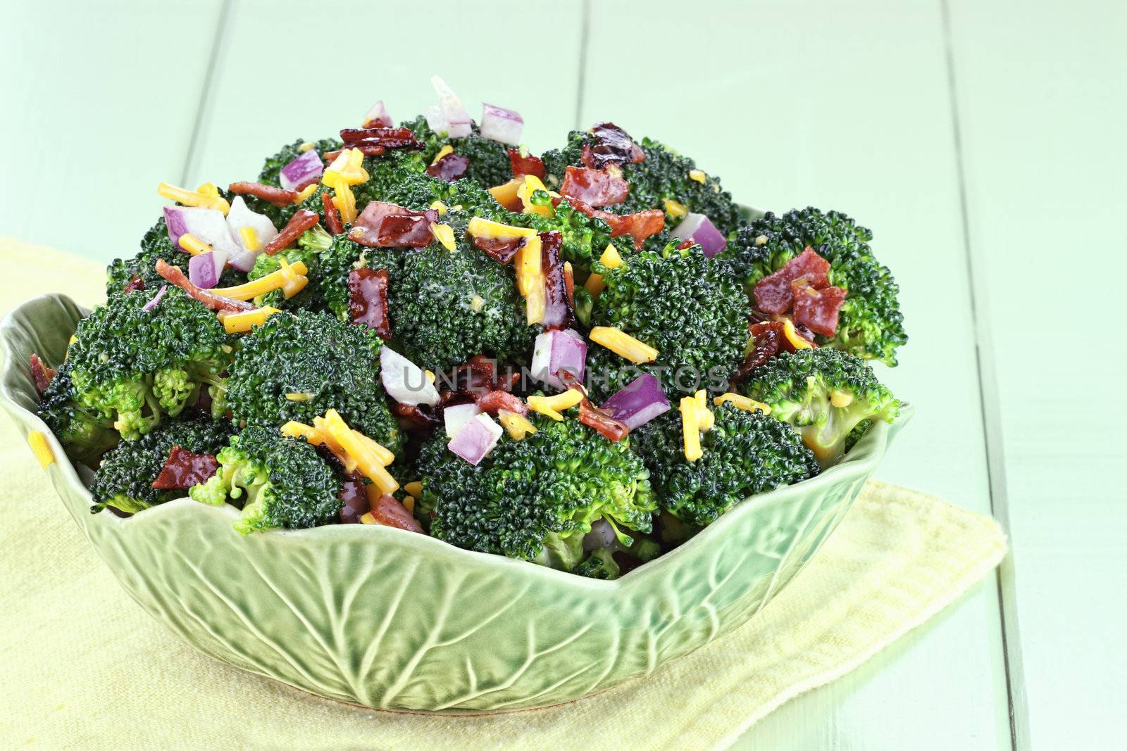 Broccoli made with fresh broccoli, cheddar cheese, red onion, bacon with mayonnaise, sugar and vinegar dressing.
