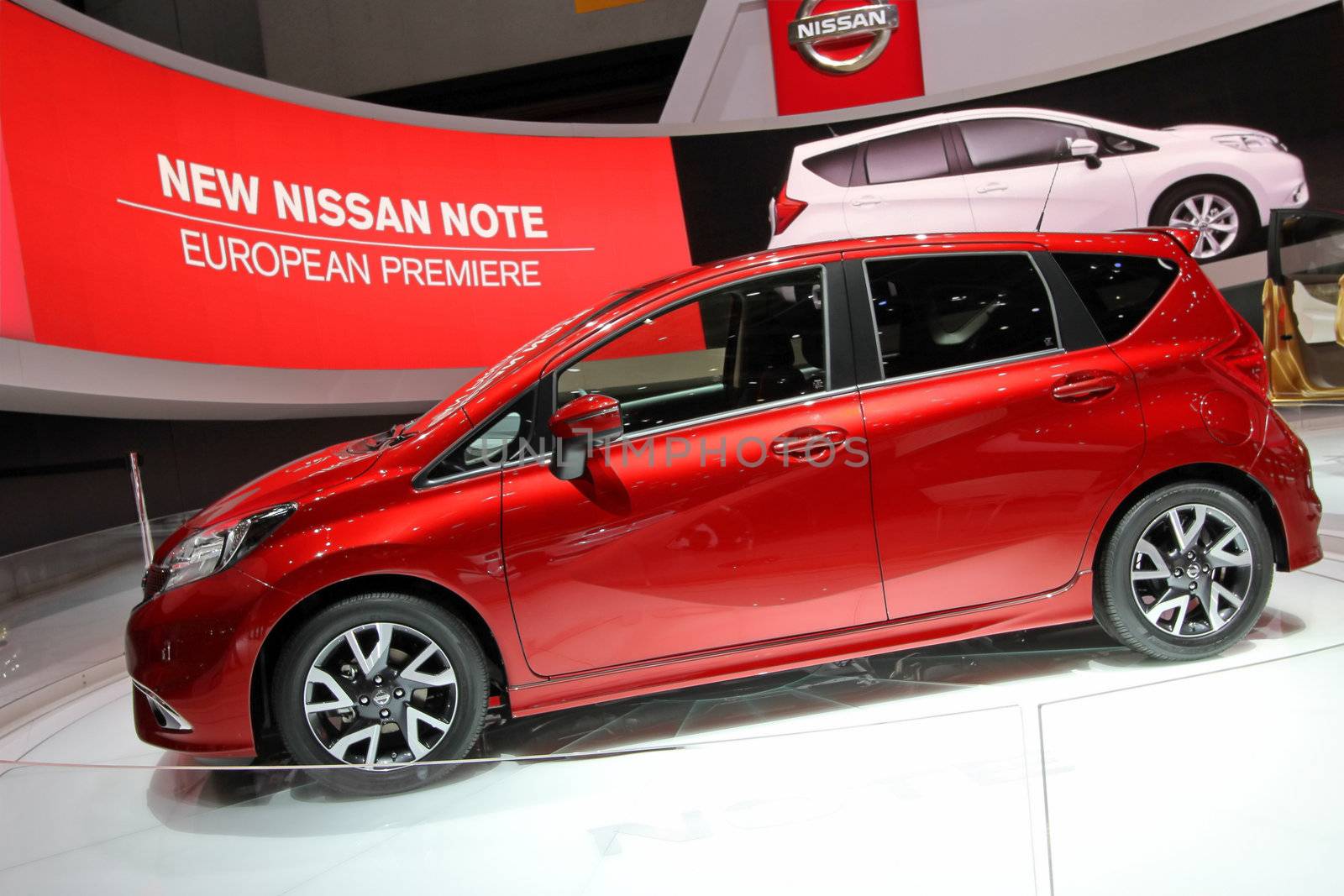 GENEVA - MARCH 8 : red nissan note car on display at the 83st International Motor Show Palexpo - Geneva on March 8, 2013 in Geneva, Switzerland.