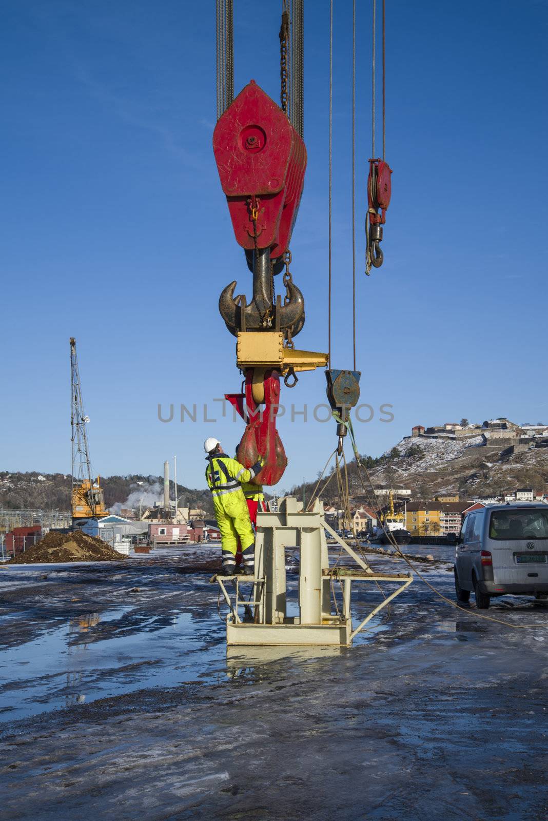 taklift, a giant seagoing crane with a lifting capacity of up to 400 tons at 45 meters, compared to the man on the picture you can see how big the hook is, the picture is shot on the quay at the port of halden february 2013