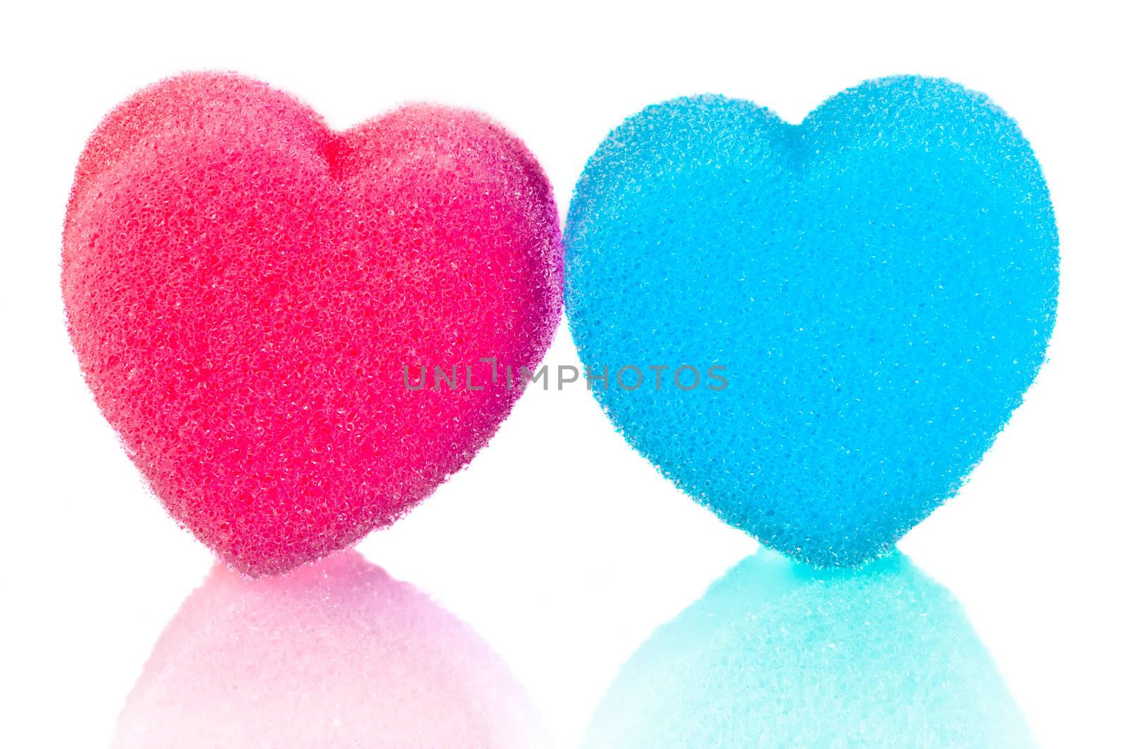 Two hearts of blue and pink lips on a white background