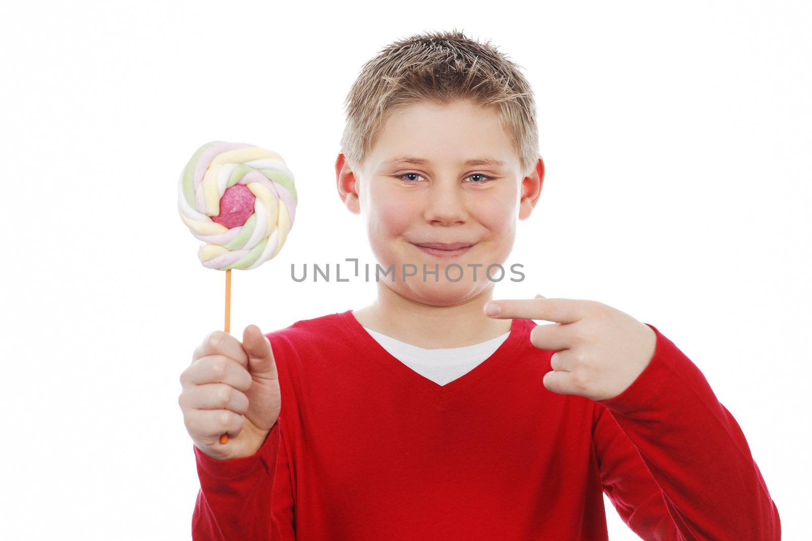 Portrait of beautiful joyful boy with lollipop 