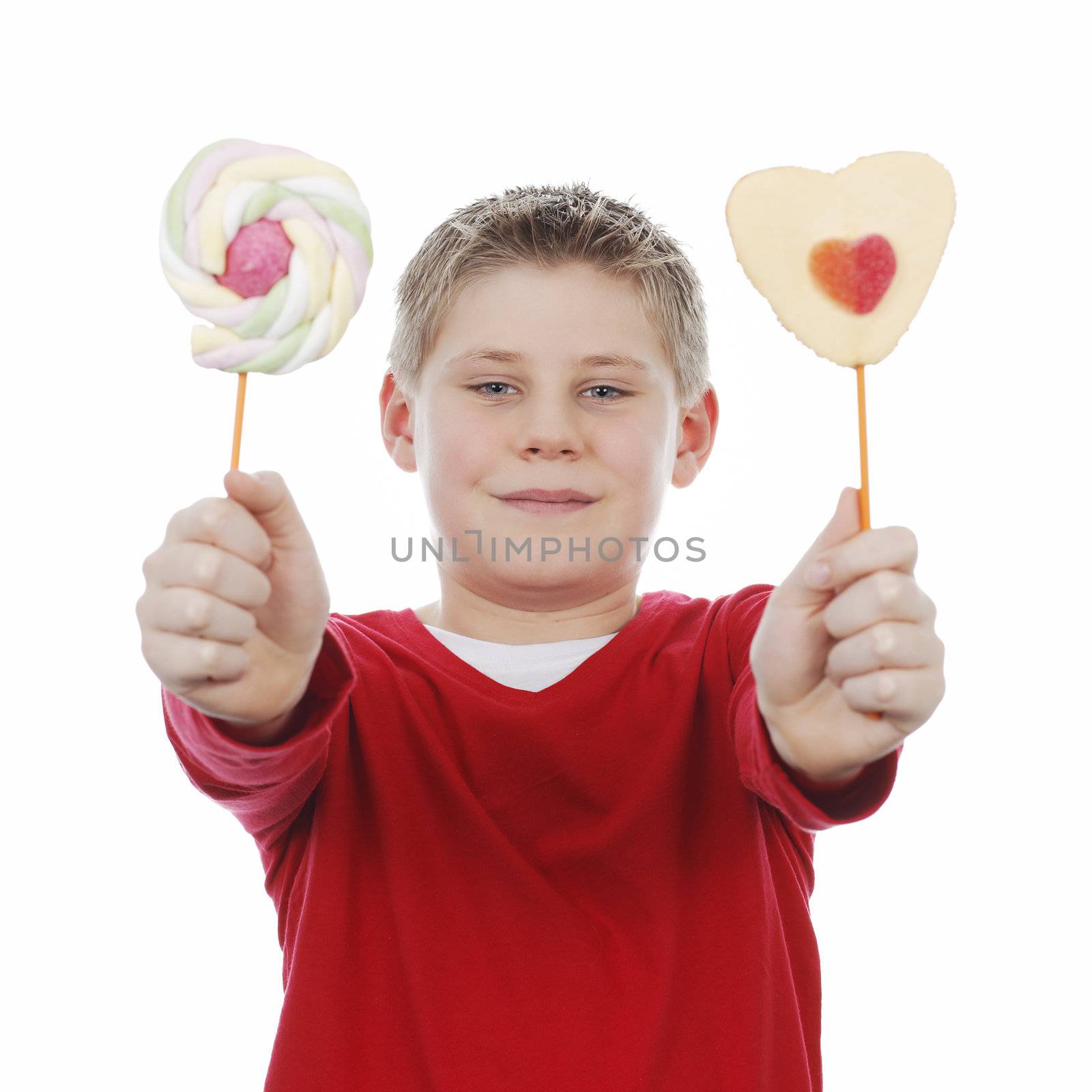 Portrait of beautiful joyful boy with two lollipops