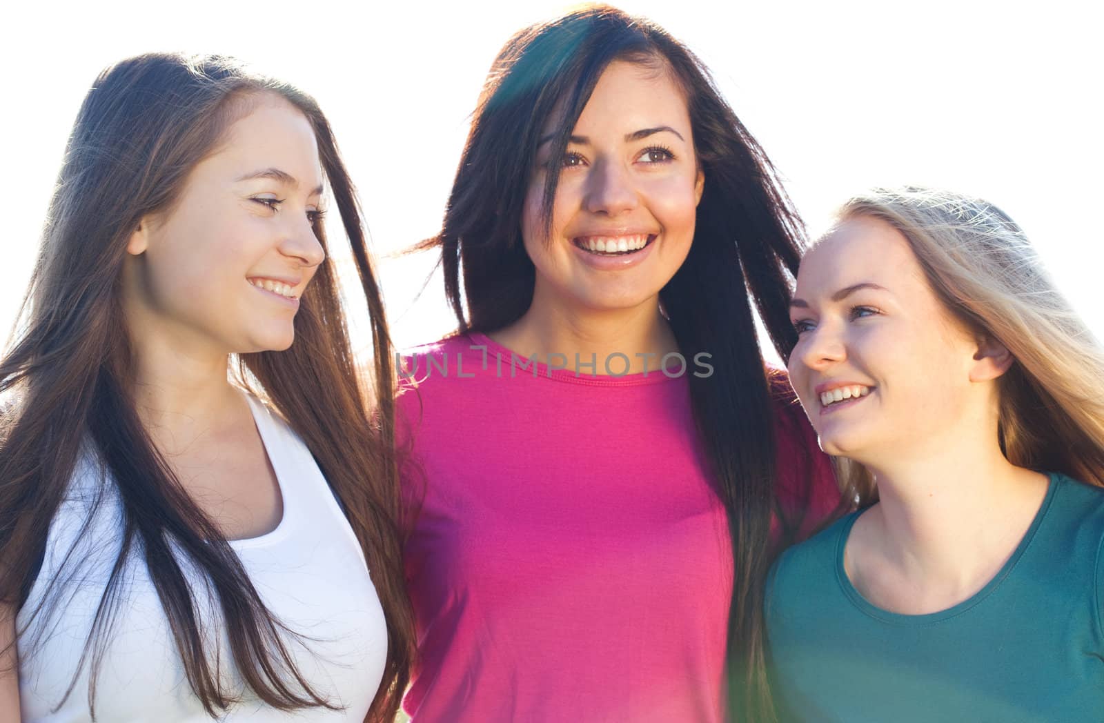 portret of three young beautiful woman on the  sky background  by jannyjus