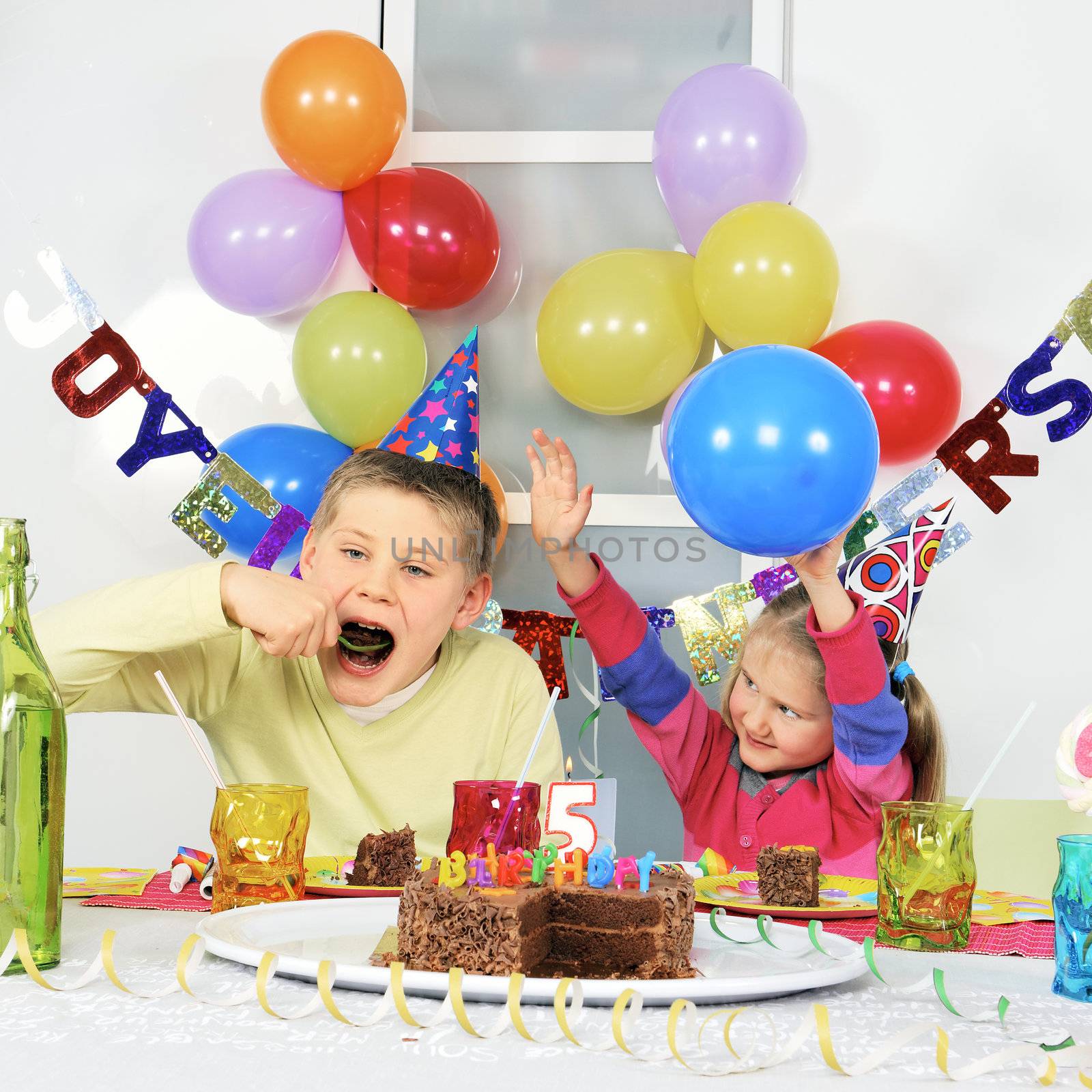 Two children at big birthday party 