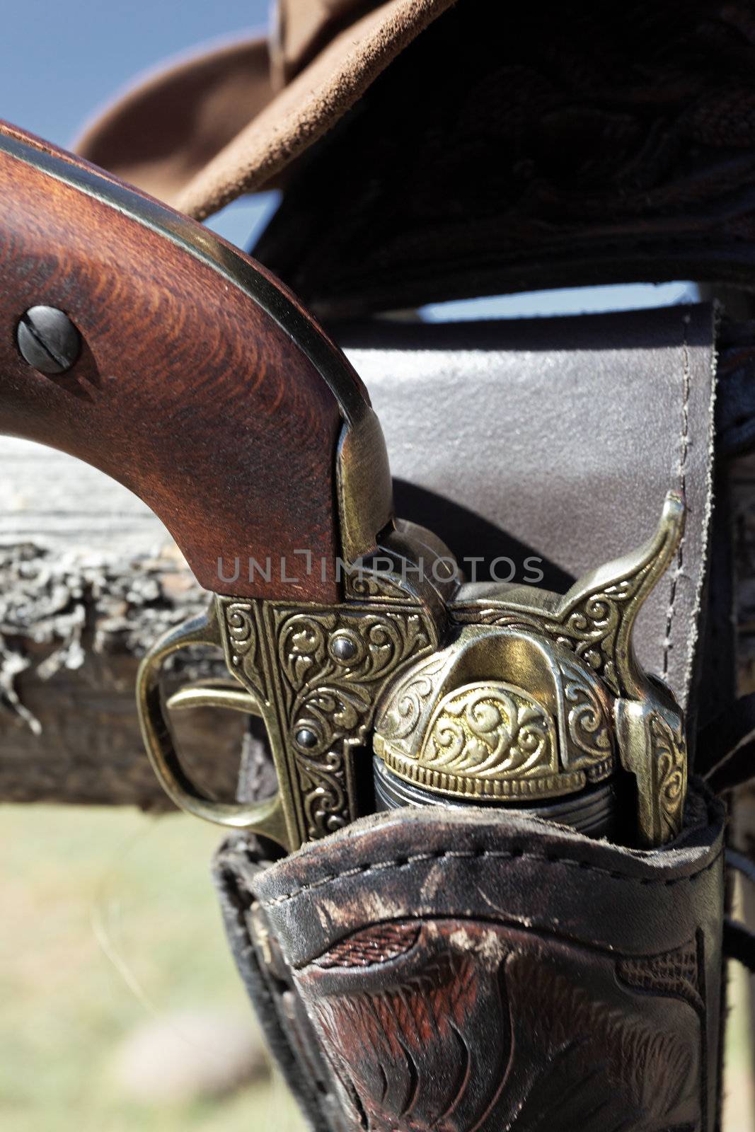 gun and hat outdoor in a ranch