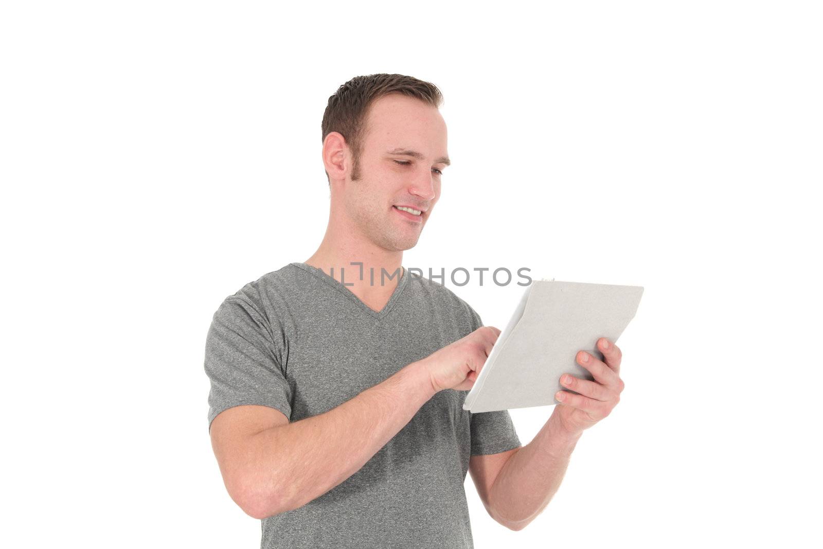 Studio shot of positive casual man with his tablet isolated on white