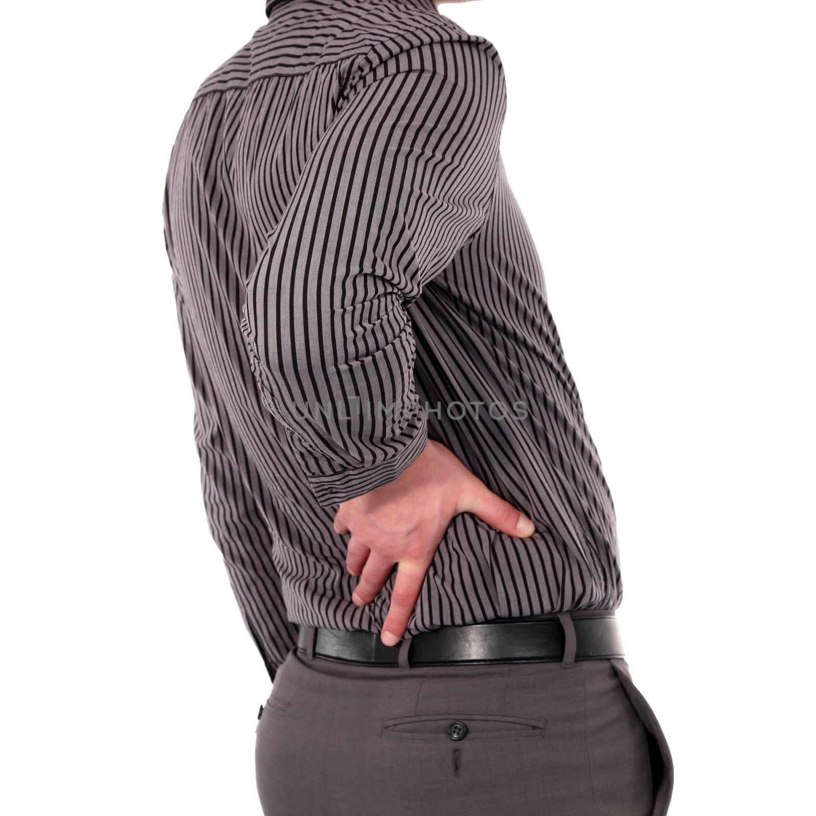 Man with back pain holding his lower back with his hand, torso portrait isolated on white