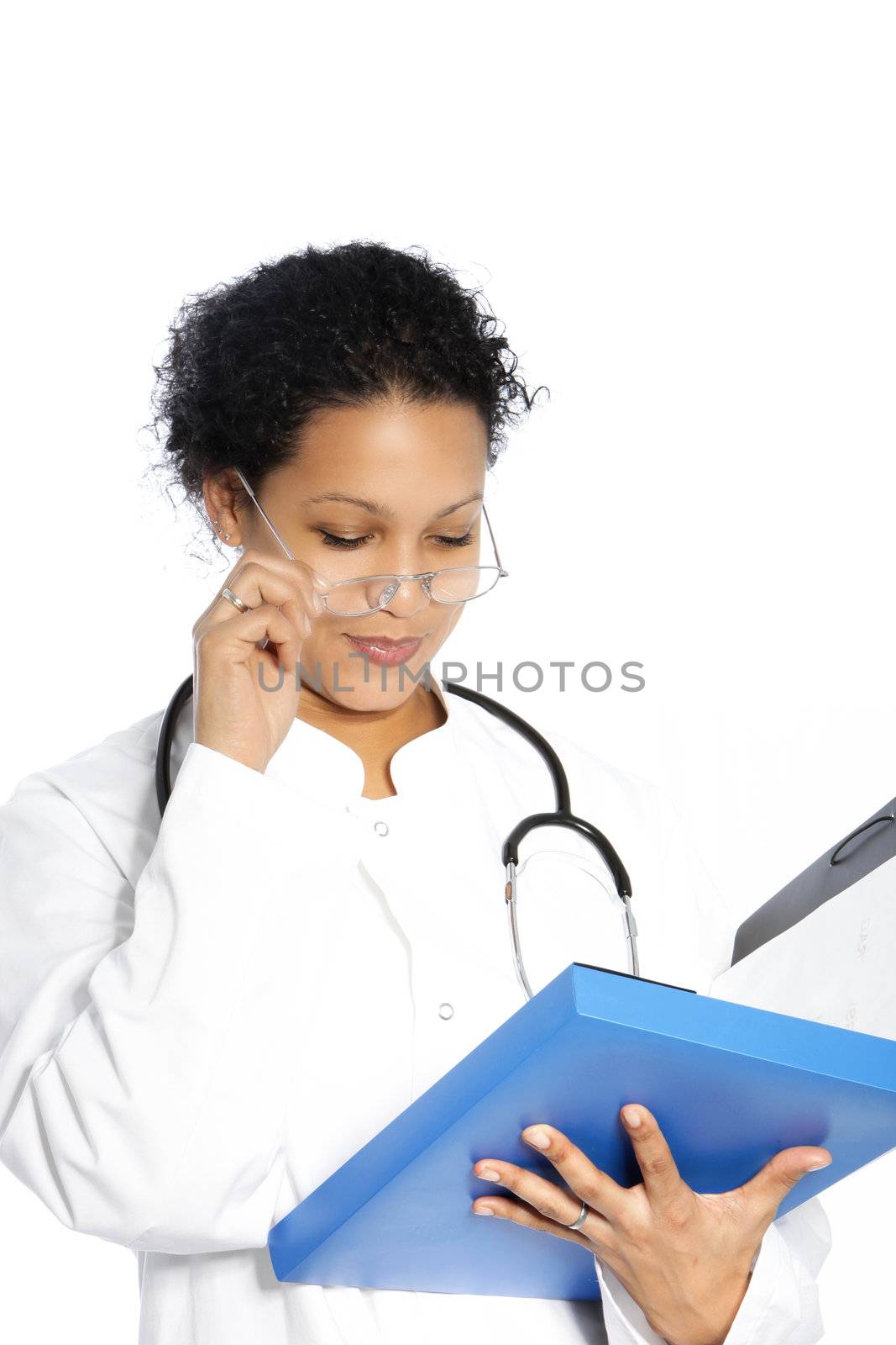 Attractive African American woman doctor reading a patients file lowering her glasses with her hand as she struggles to read isolated on white