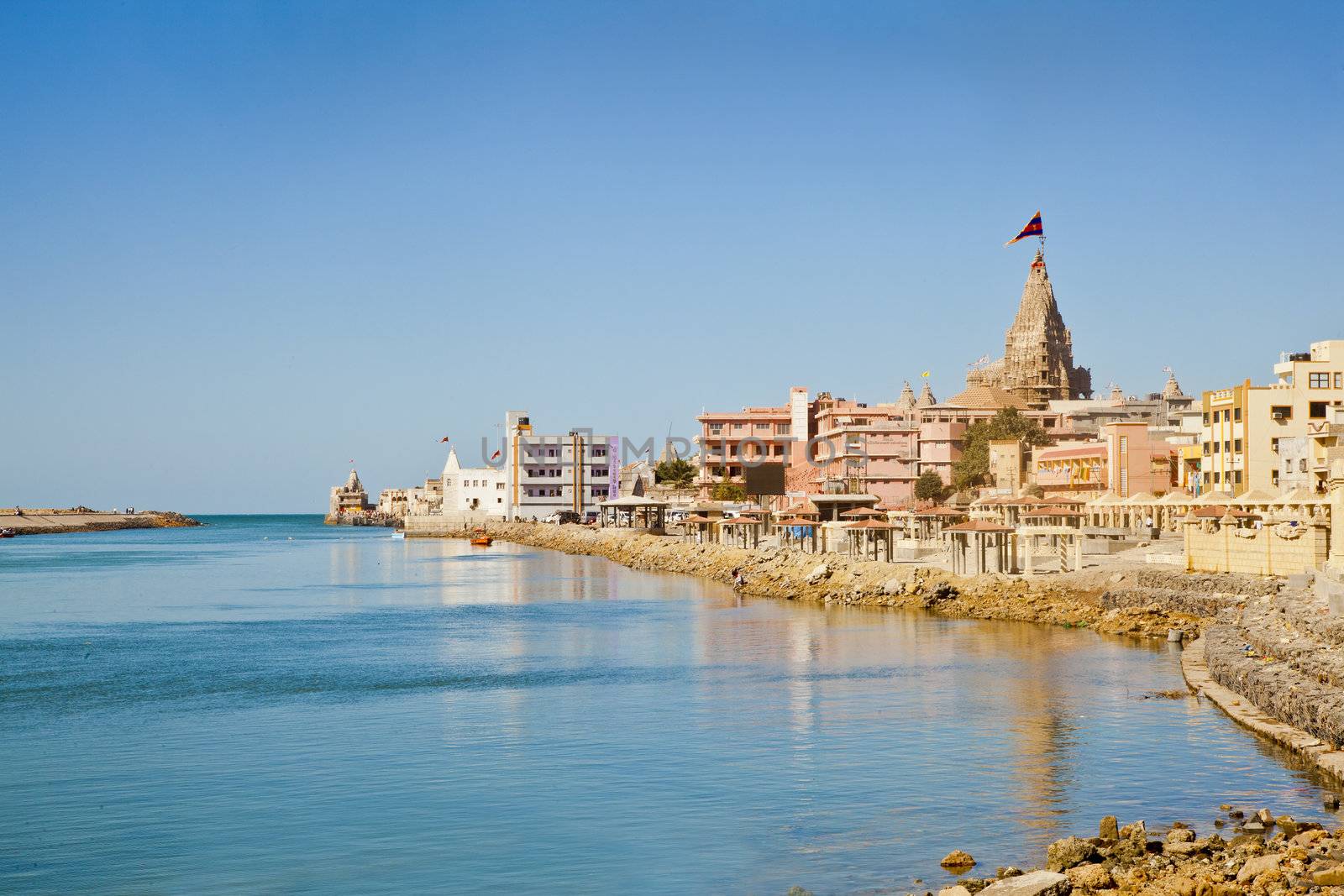 Dwarka Roadtrip. Landscape of Dwarka Bay, Arabian Sea and promenade from the public pathway leading upto the Shree Dwarakadheesh Krishna Temple a significant religious place and pilgrimage for hindus on the coast of Gujarat, India