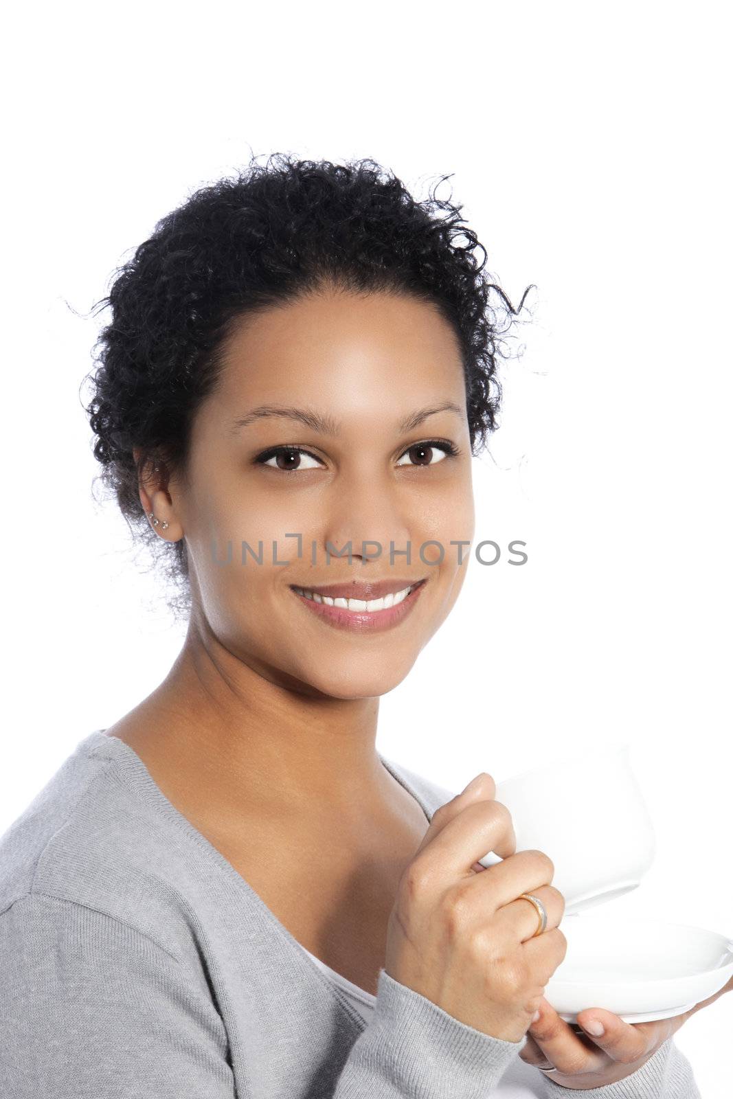 Beautiful smiling African American woman enjoying a cup of tea, head and shoulders portrait isolated on white