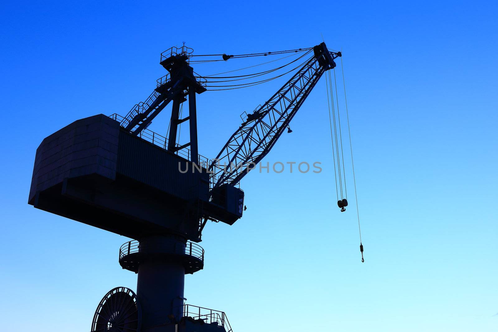 Cranes in dockyard  at sunset