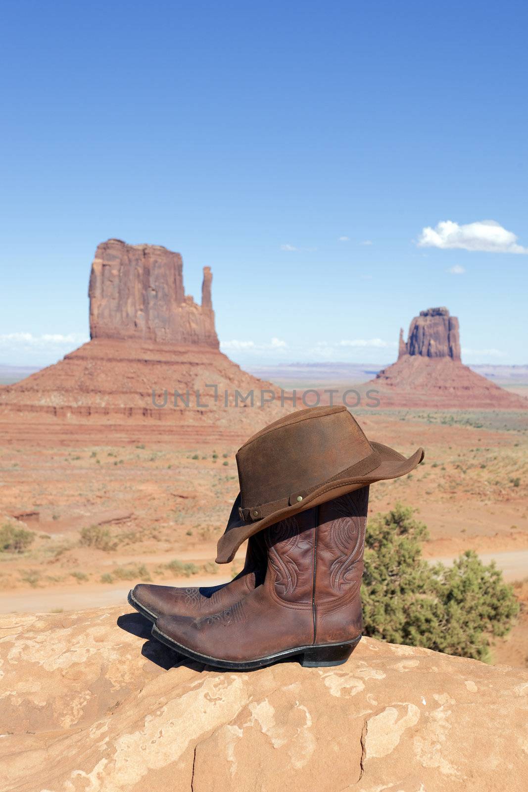 boots and hat in front of Monument Valley, USA