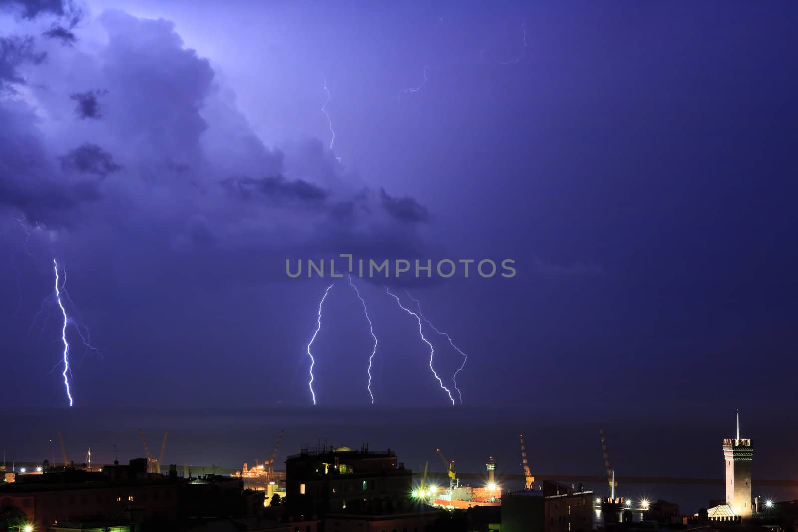 Lightning into the sea near the port of Genova, Italy during a violent storm