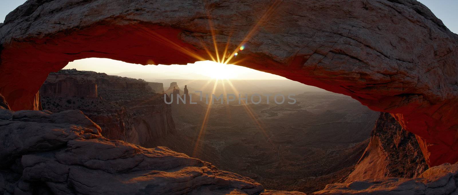 panoramic view of sunrise at Mesa Arch by vwalakte