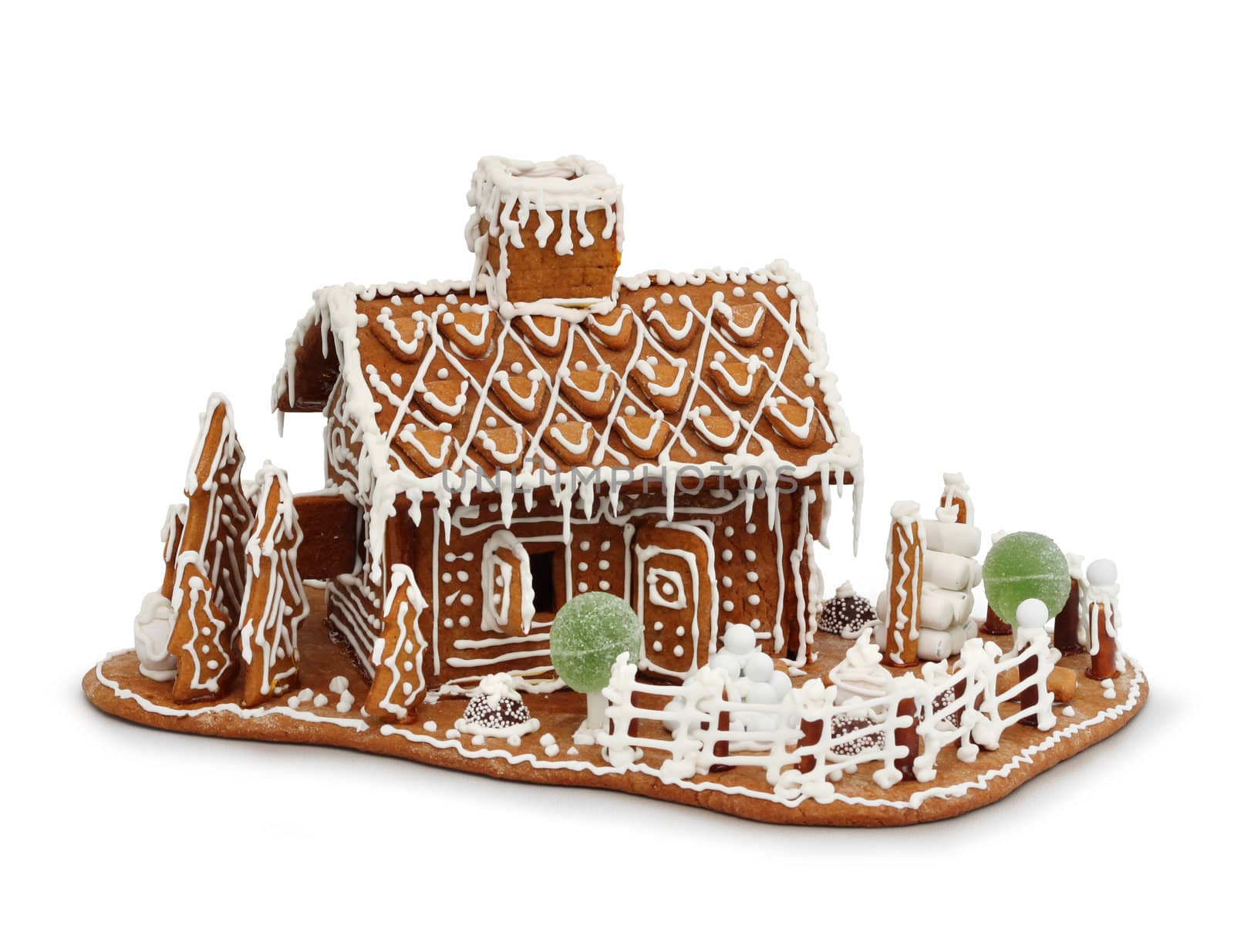 Homemade gingerbread house cottage isolated on white