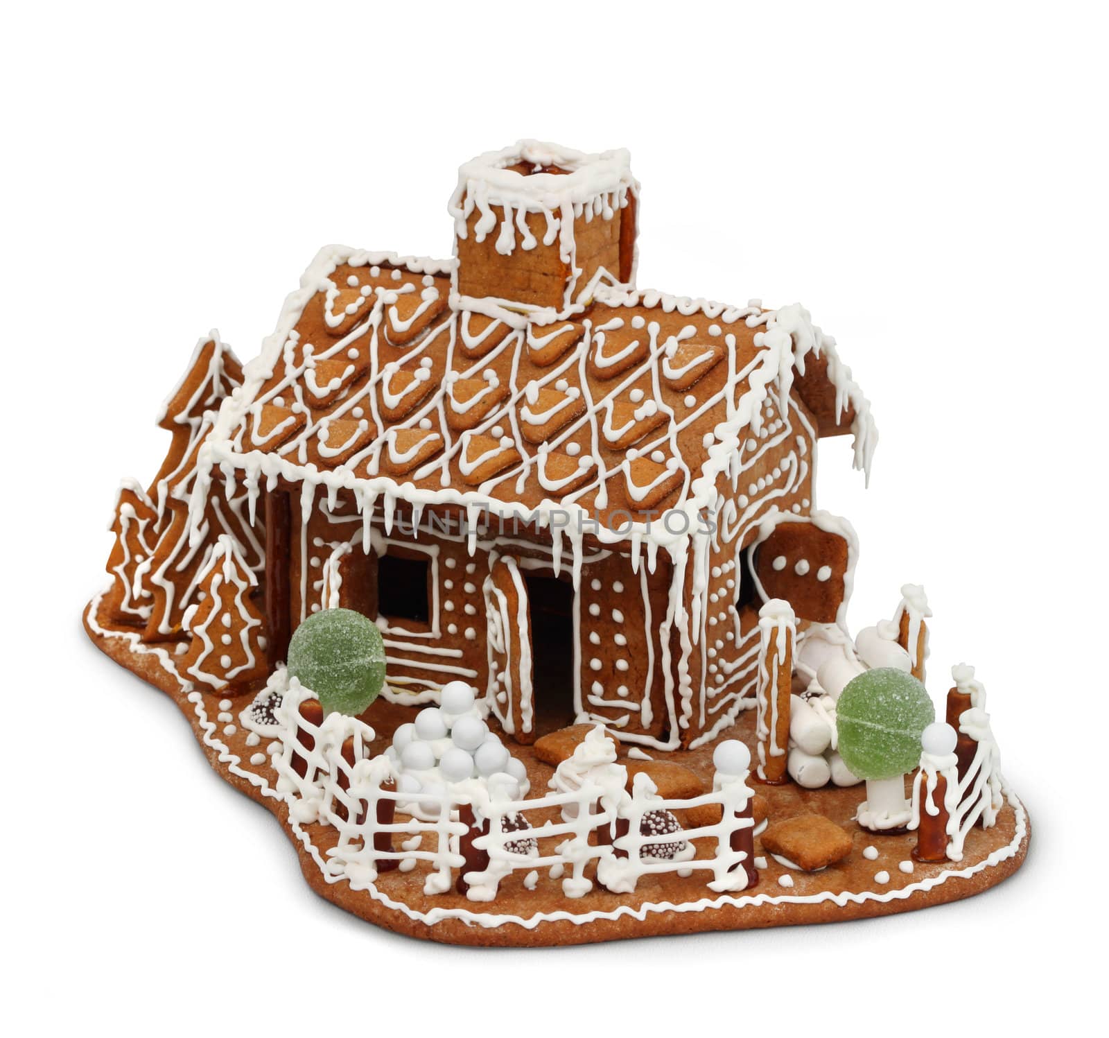 Homemade gingerbread house cottage isolated on white