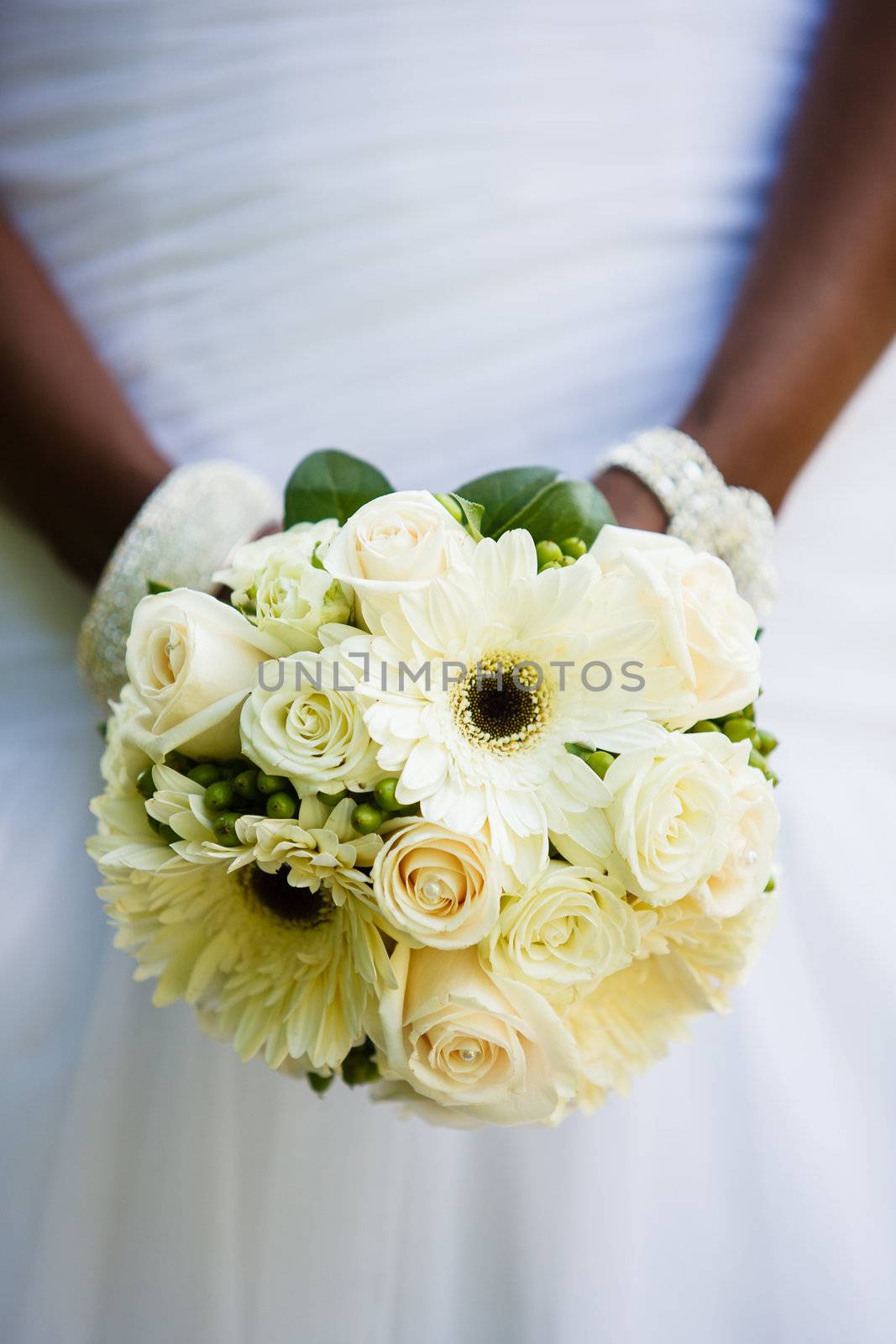 Black woman holding a wedding bouquet