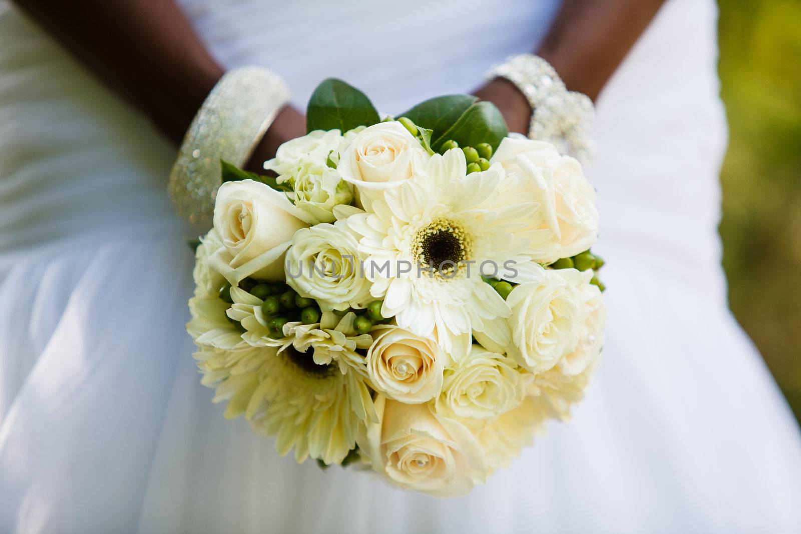 Black woman holding a wedding bouquet