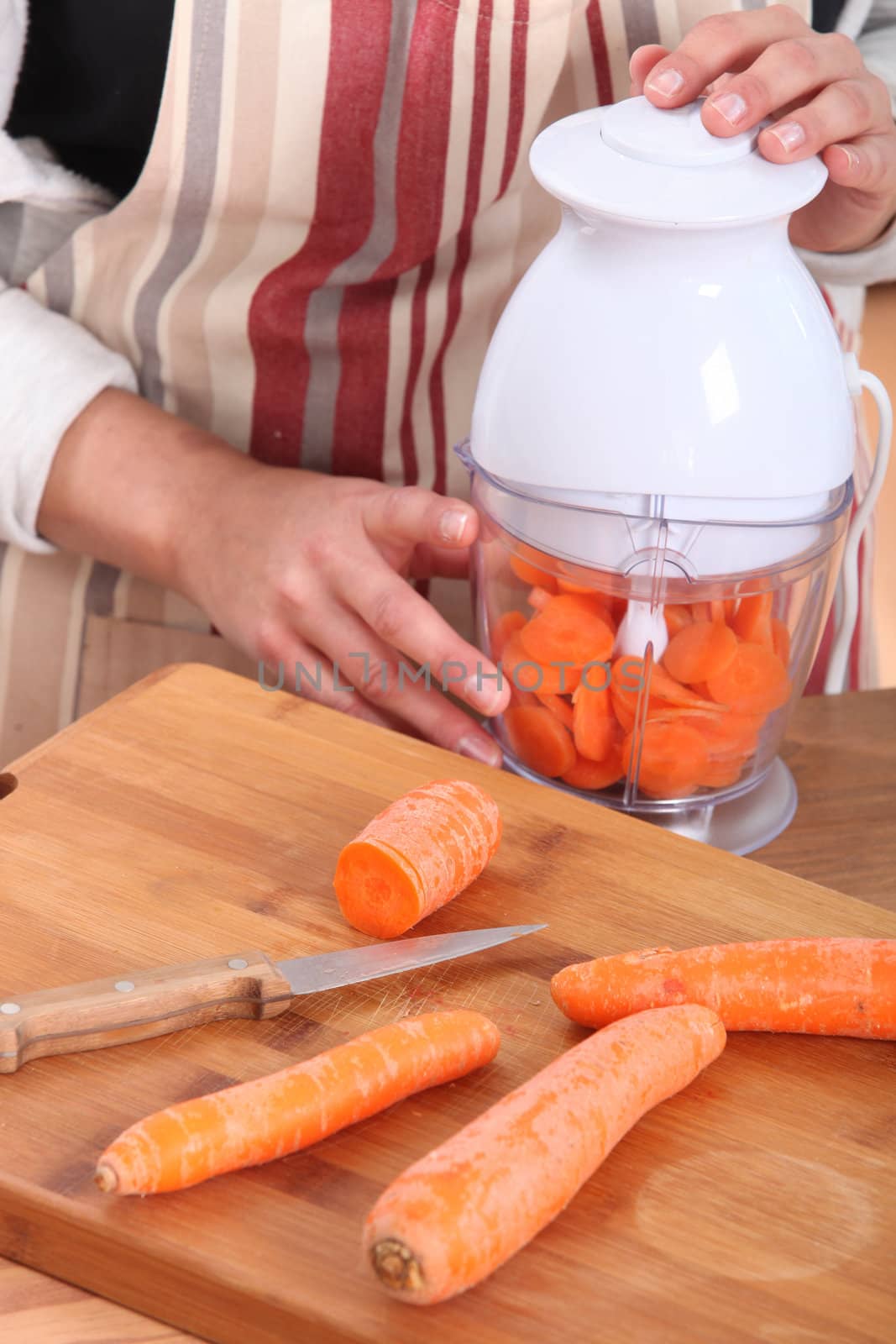 Woman chopping carrots