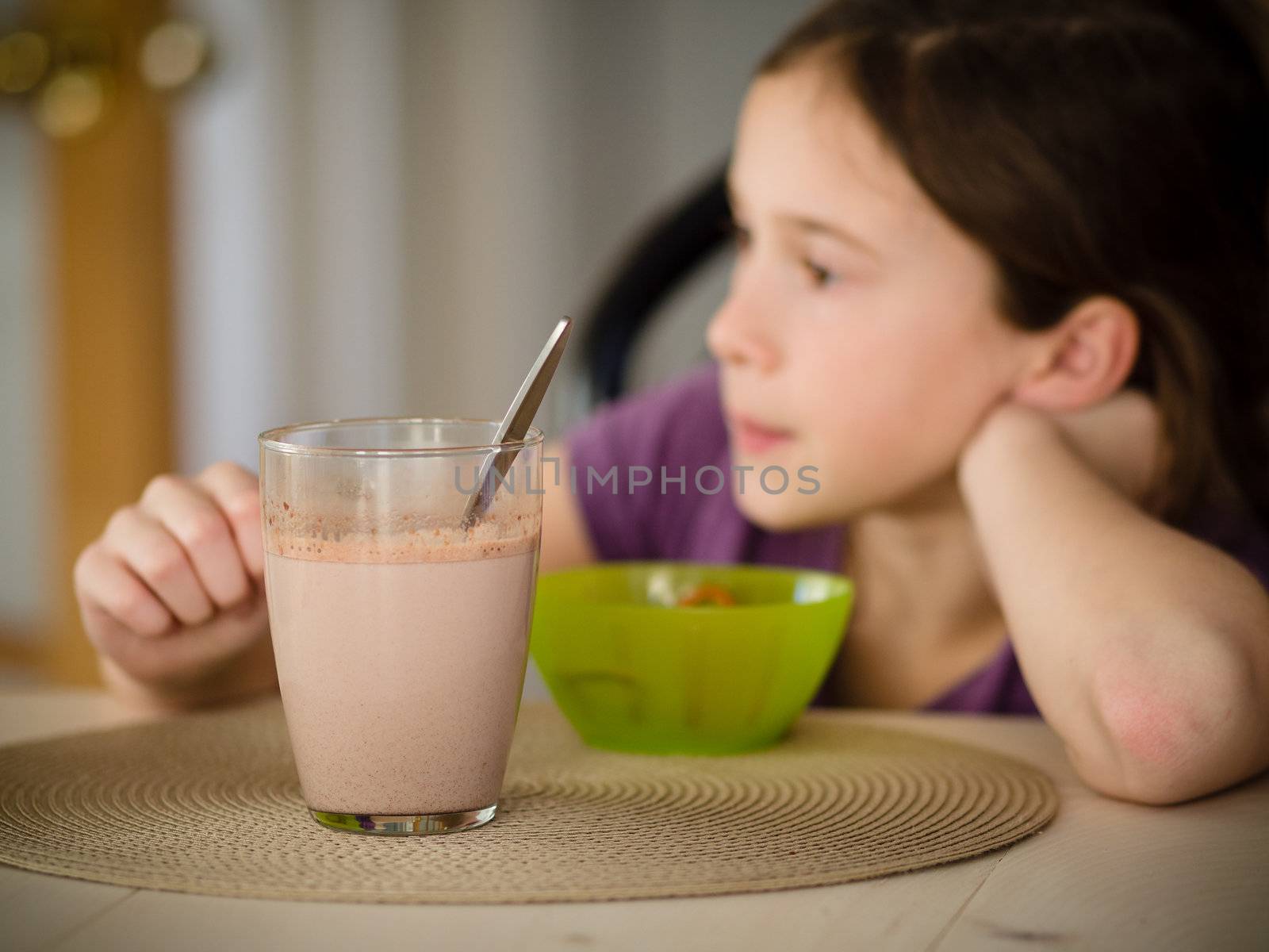 Girl having a hot chocolate and a snack