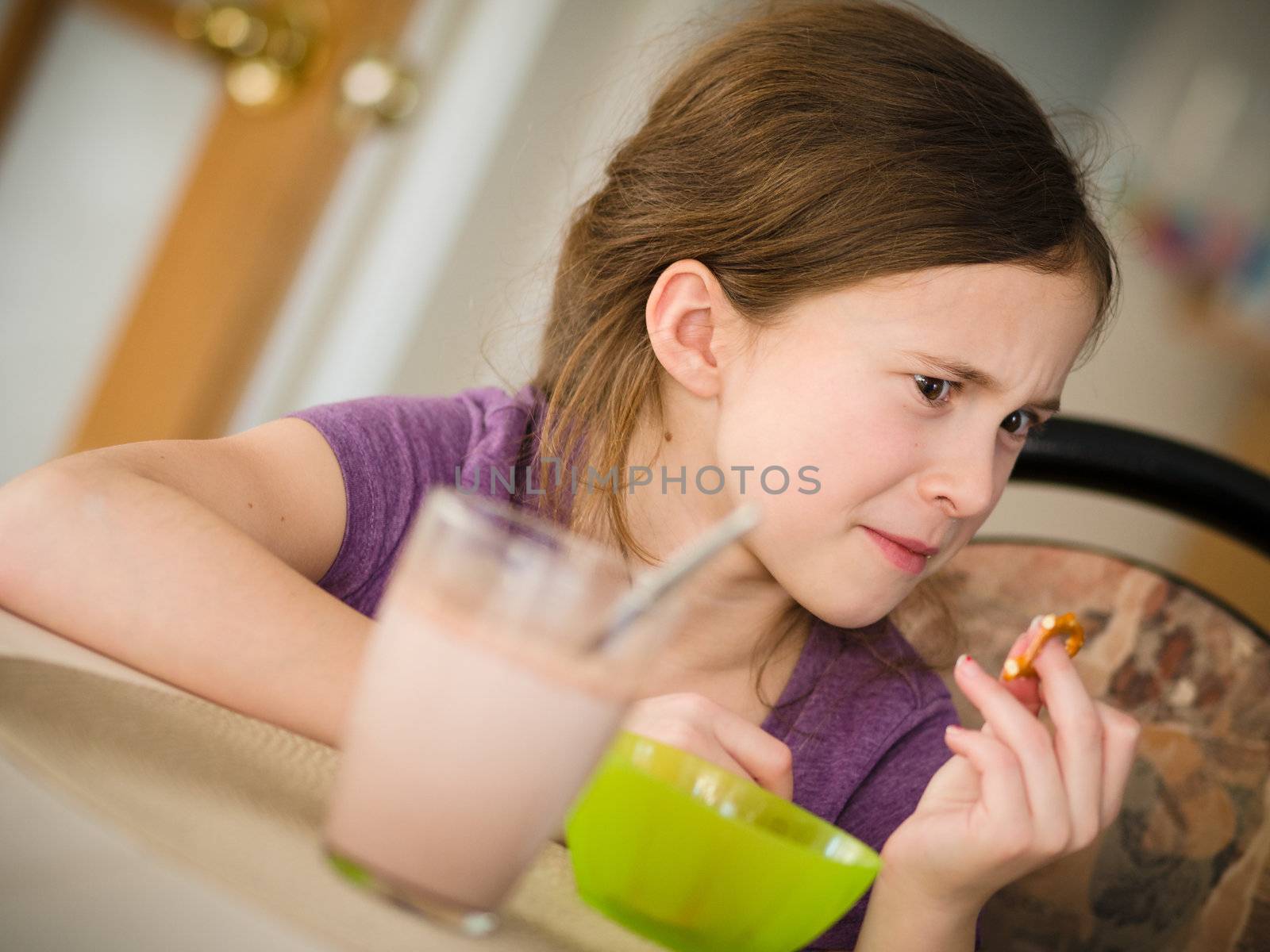 Girl having a hot chocolate and a snack