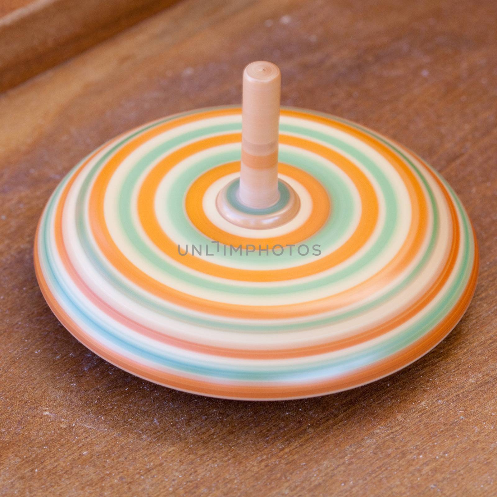 wooden spinning top at the fair by jannyjus