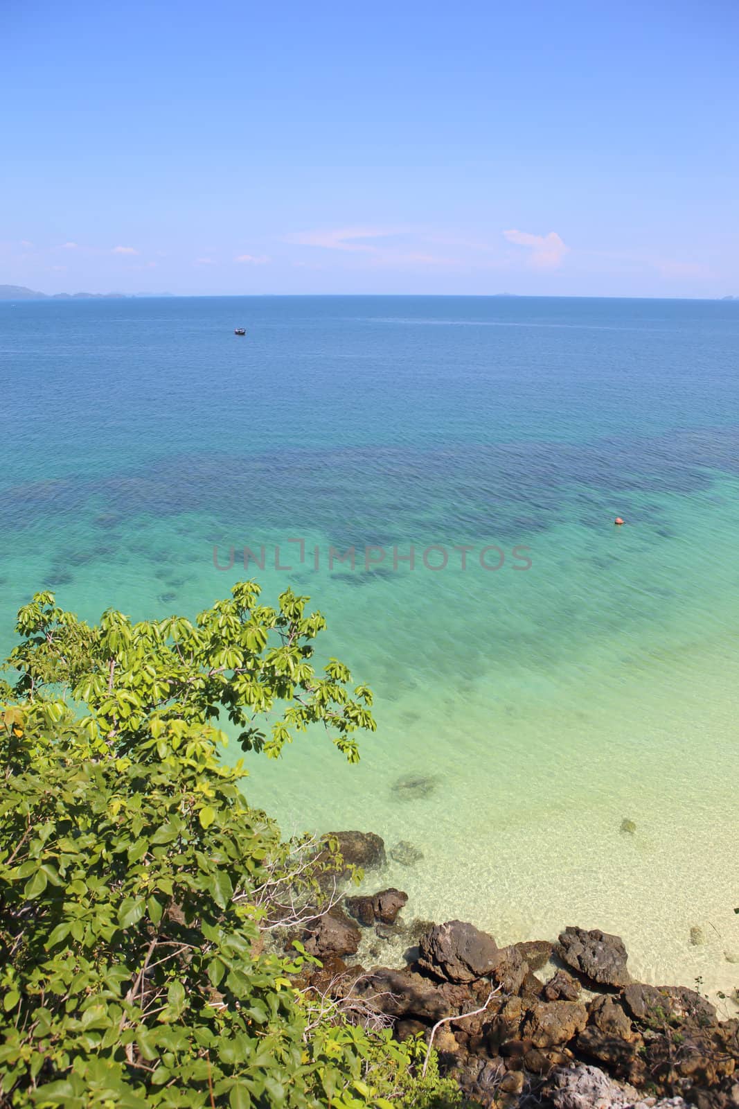 Beautiful white sand beach on island with crystal clear sea, Andaman sea, Thailand