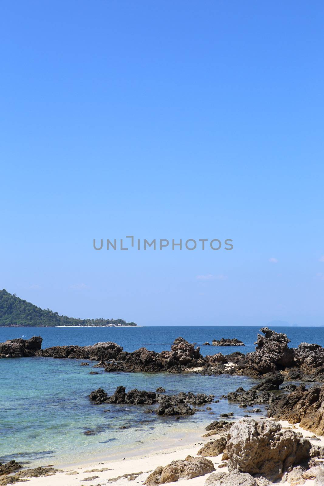 beach with rocks and blue sky,Thailand