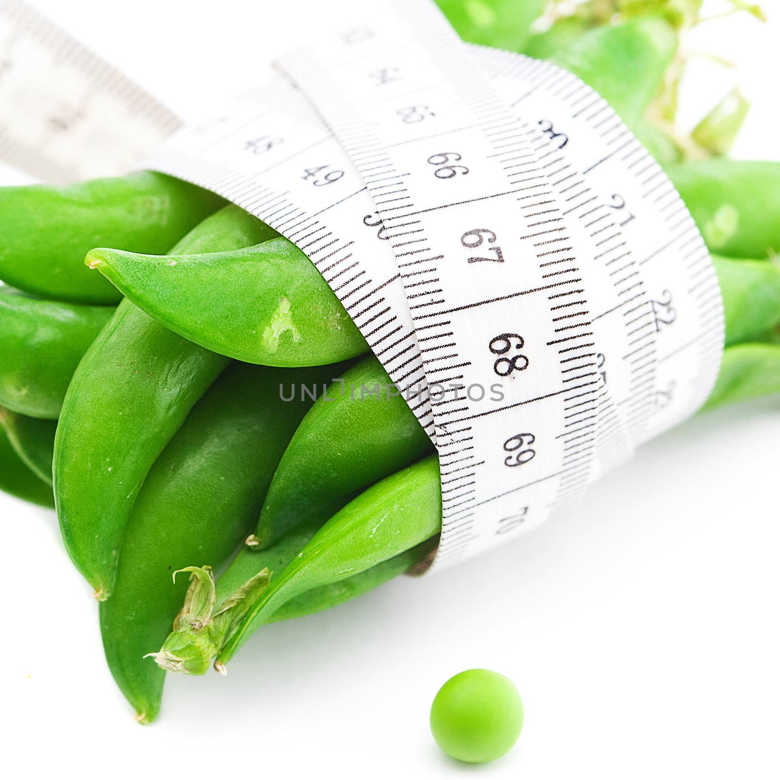 peas and measure tape isolated on white by jannyjus