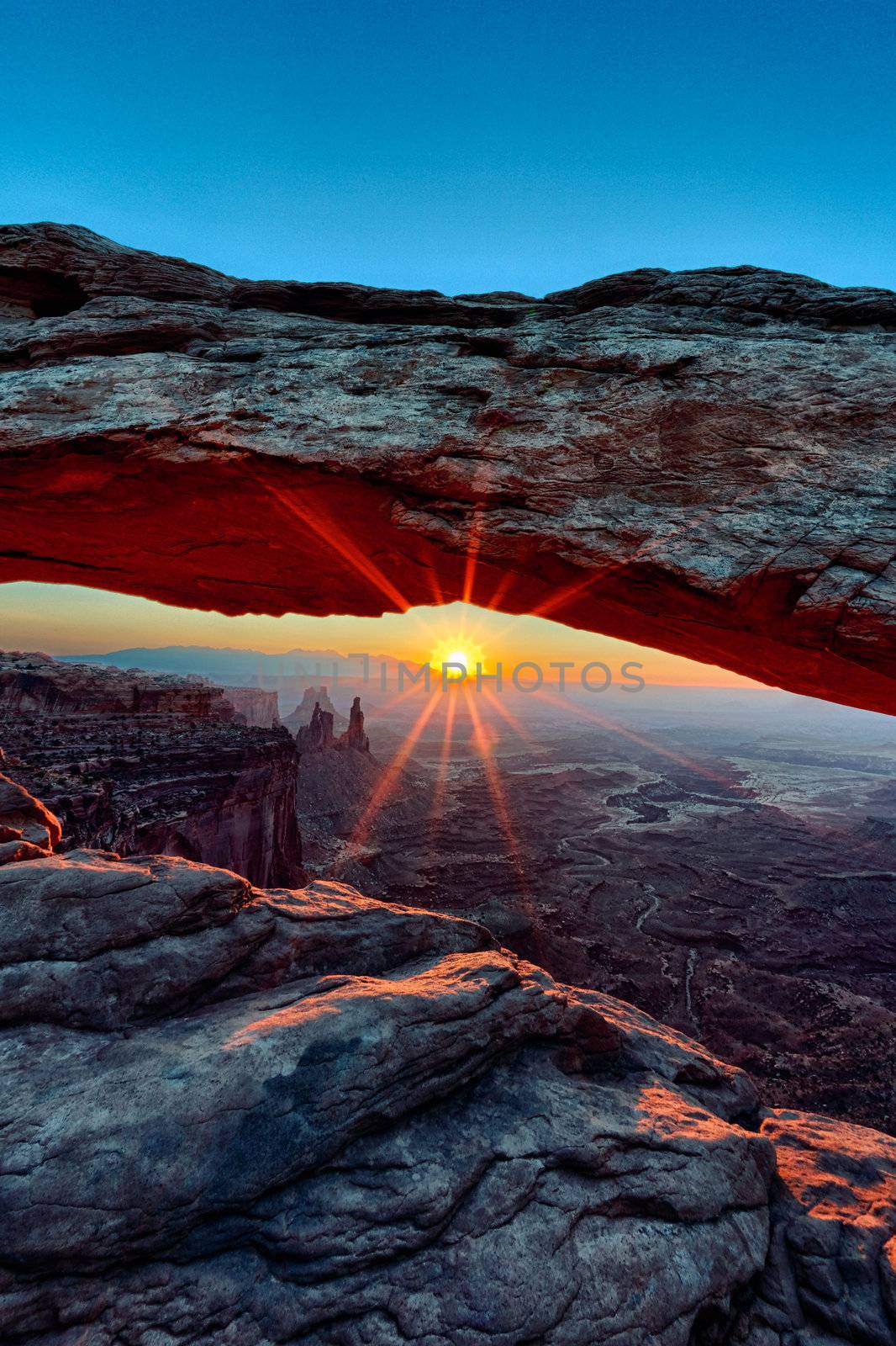 vertical view of Sunrise at Mesa Arch in Canyonlands National Park, Utah, USA 