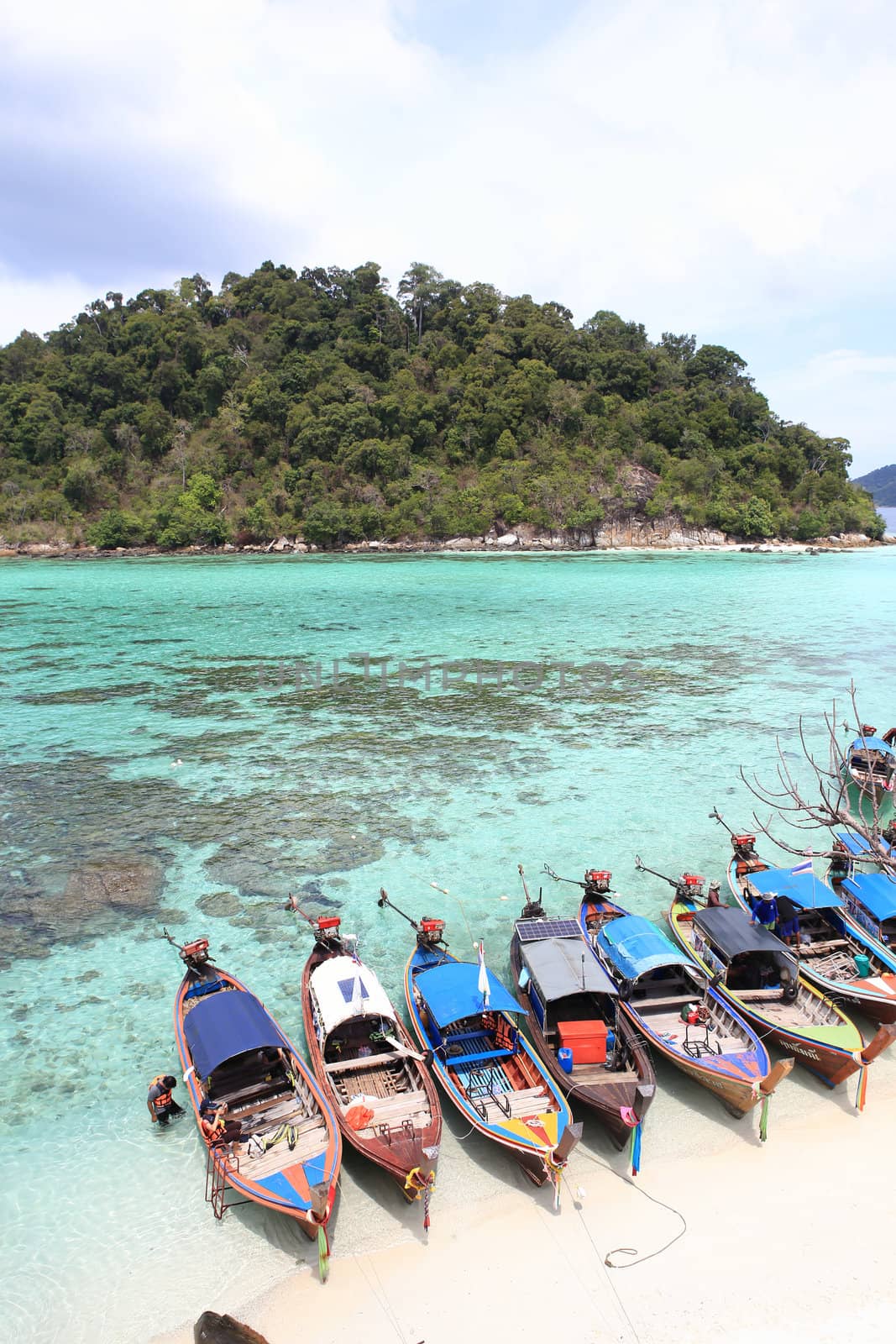 Traditional Thai longtail boat at the beach by rufous