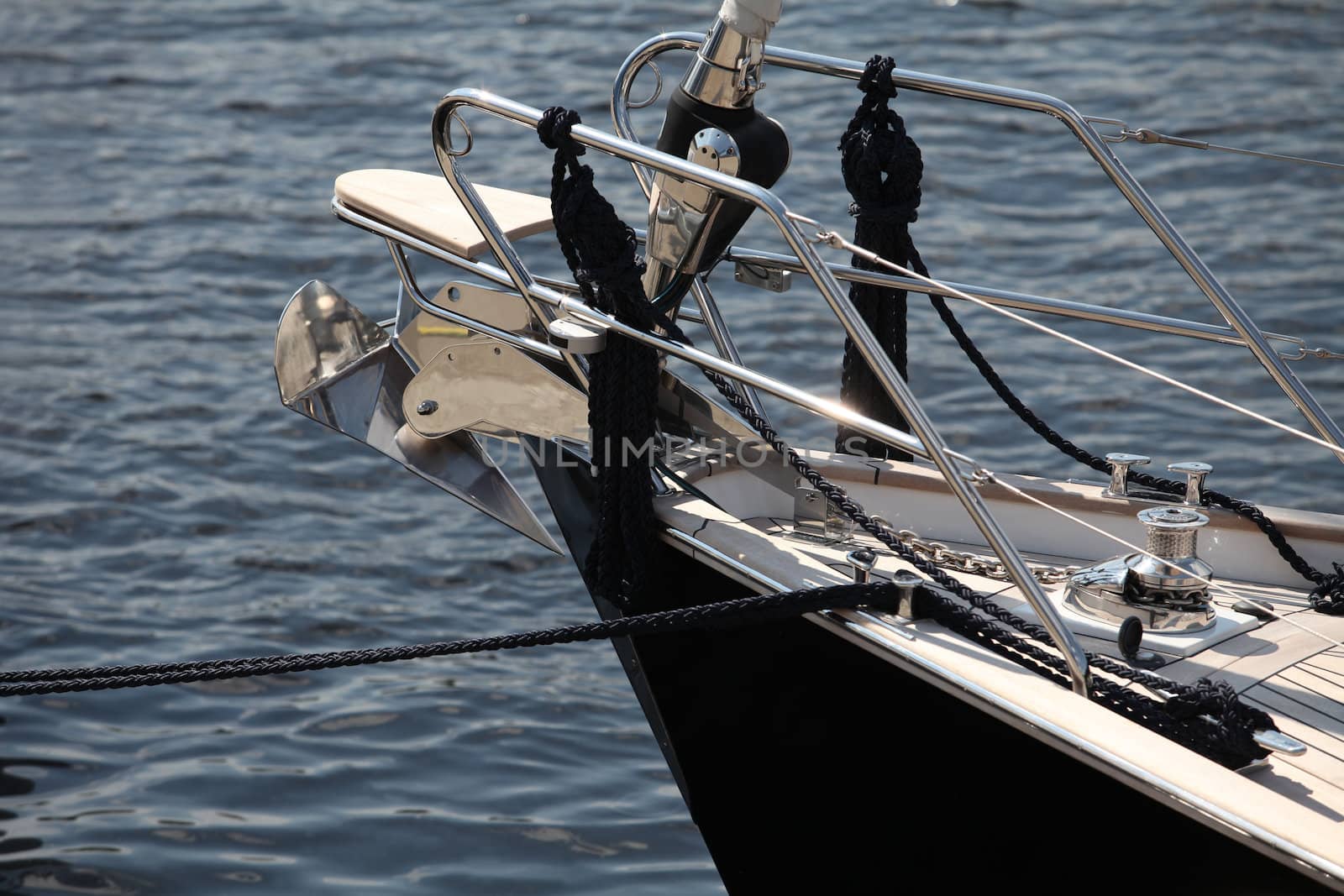 Modern sailing yacht at the pier, the fragment