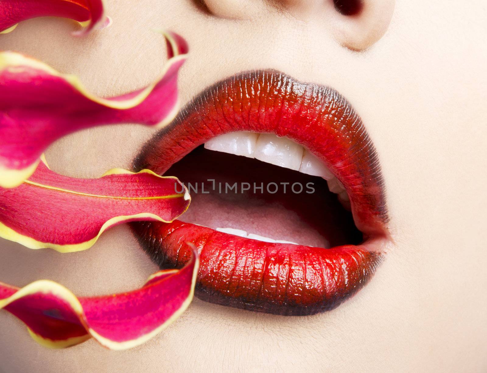 Woman's lips with yellow flower by BDS