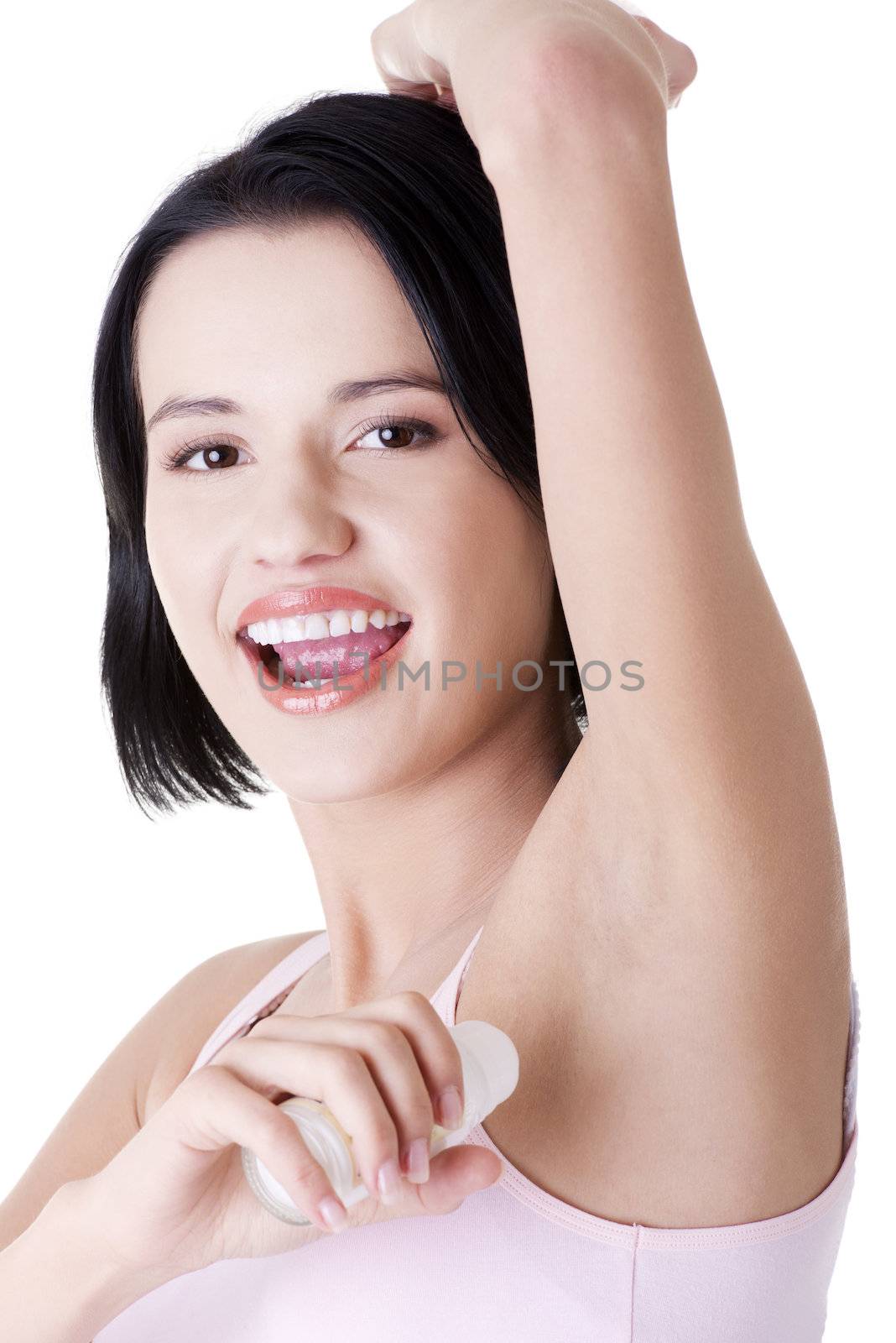 Beautiful young woman using antiperspirant