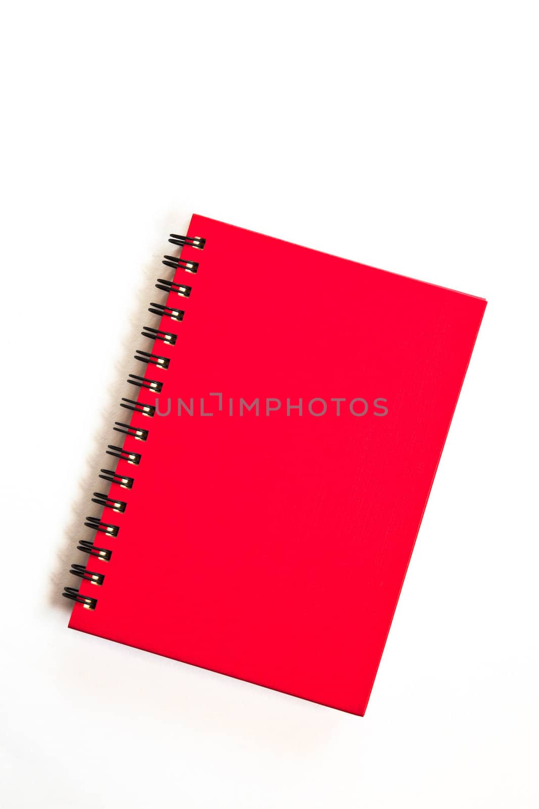 red notebook on white background