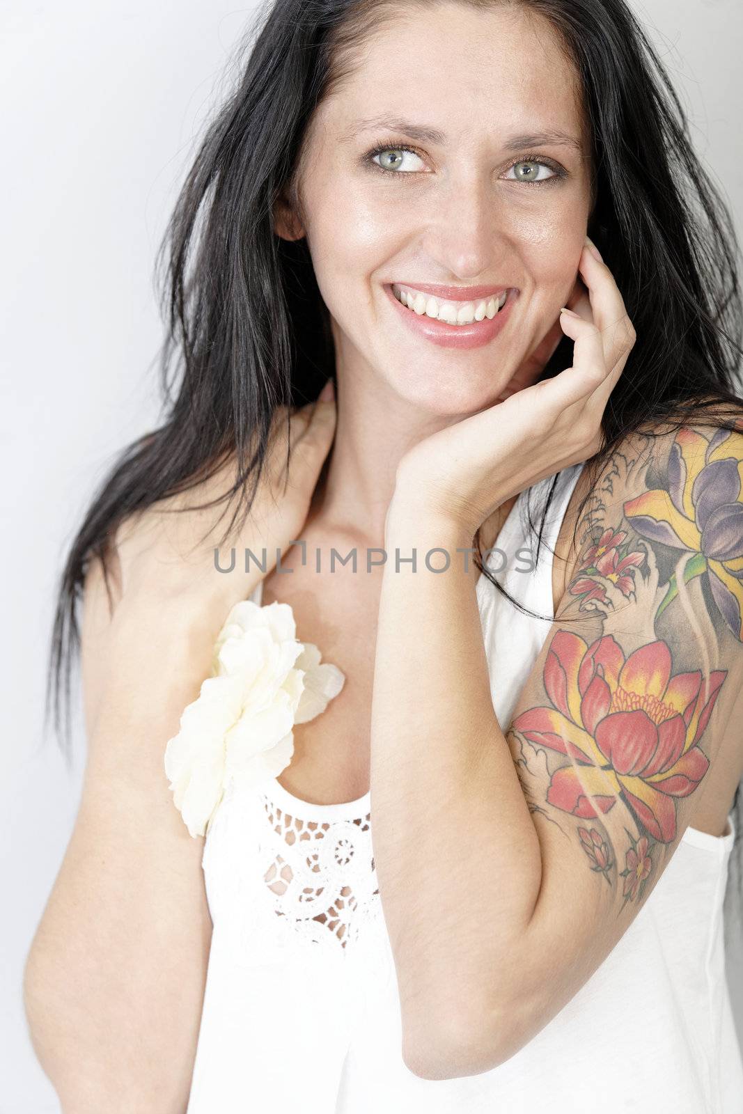 Portrait of a beautiful young woman with a tattoo