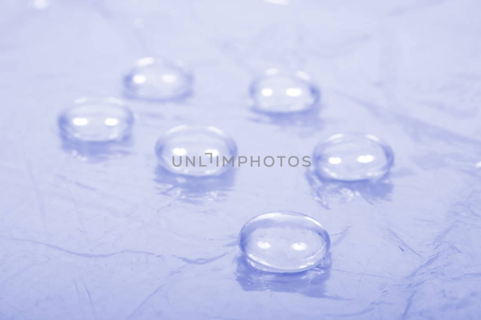 six water drops on the blue background