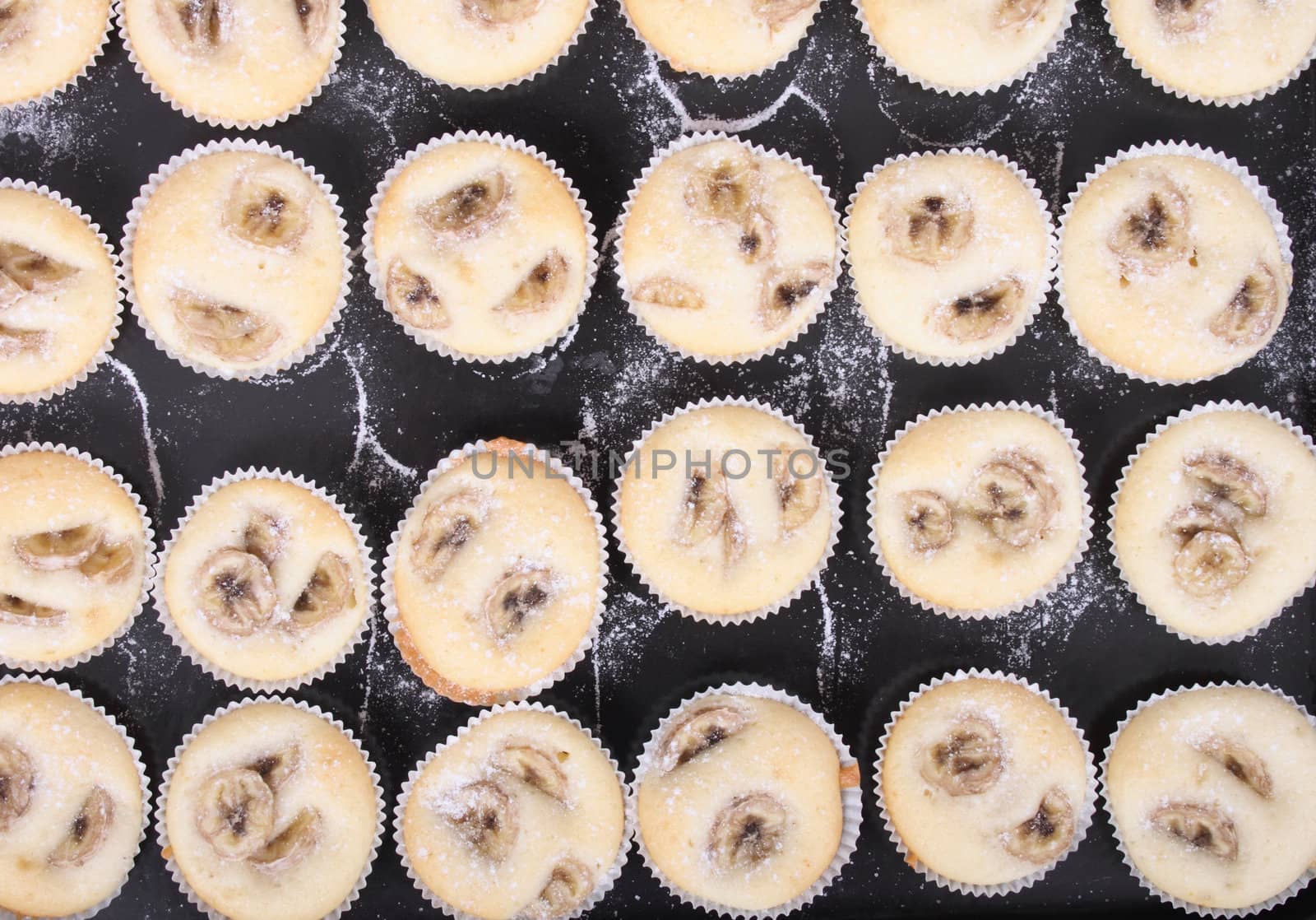 fresh banana muffins on the black background