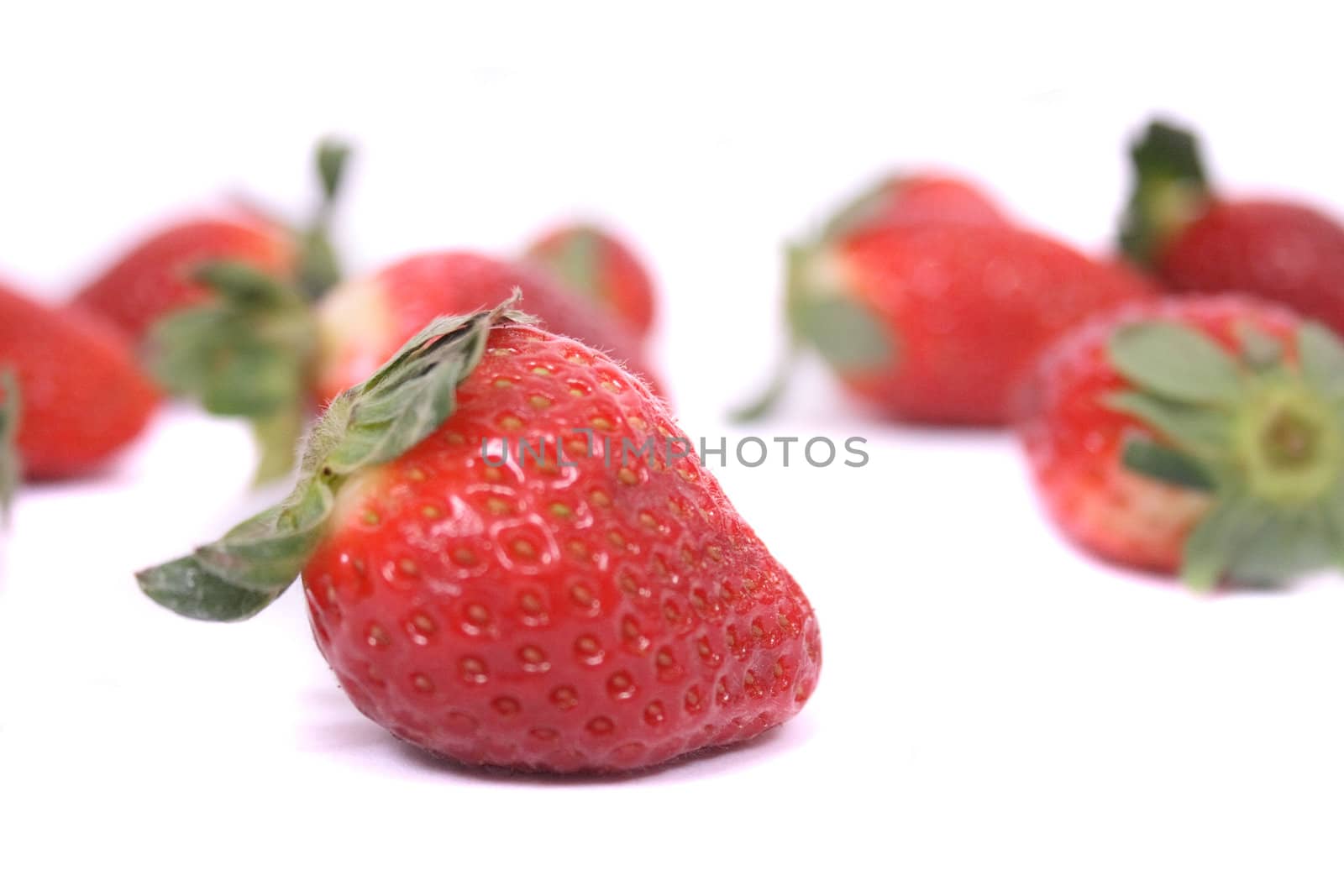 fresh red strawberries on the white background