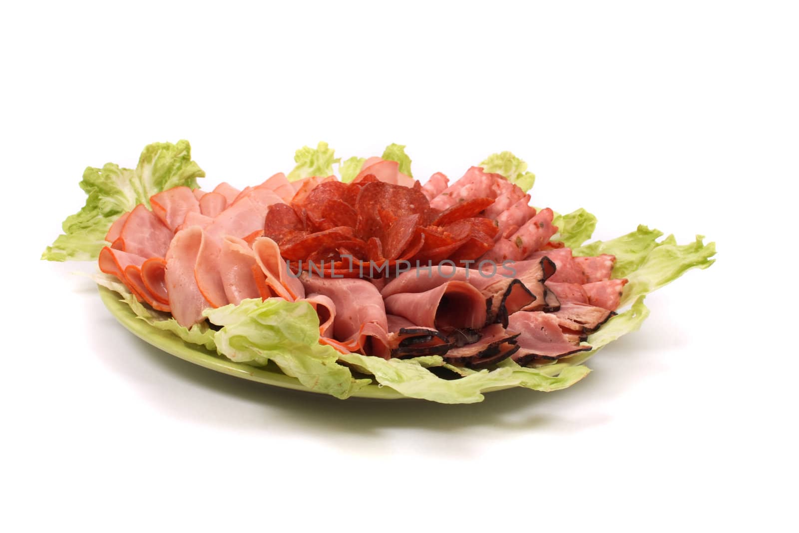 salami and lettuce on the white background