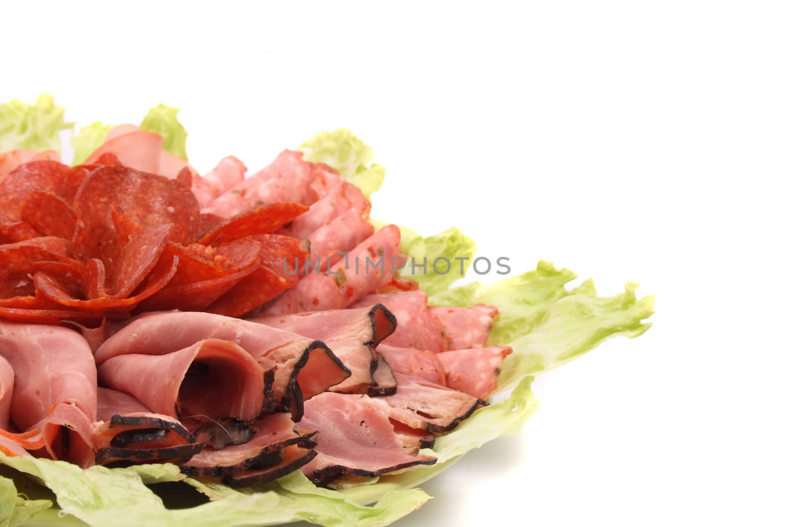 salami and lettuce on the white background