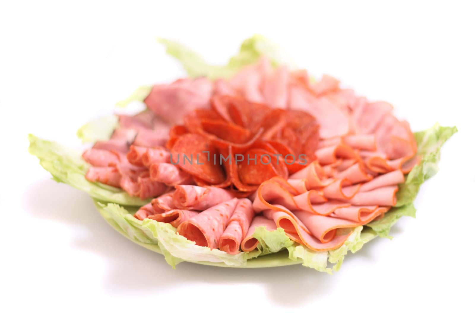 salami and lettuce on the white background