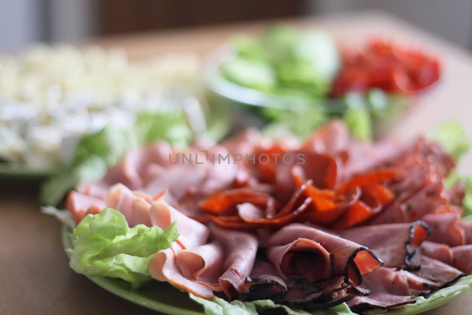 detail of the great dinner with salami and salad 