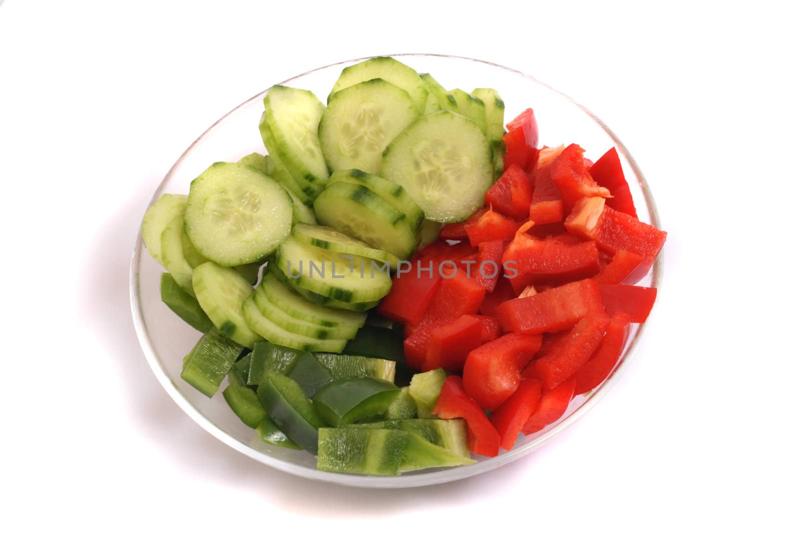 fresh vegetables (cucumber and pepper) on the white background